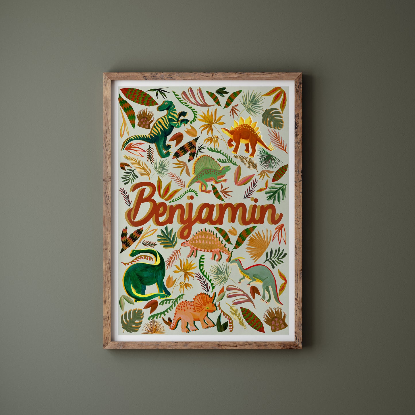Framed children's poster with dinosaur illustrations and the name 'Benjamin' on a dark gray background