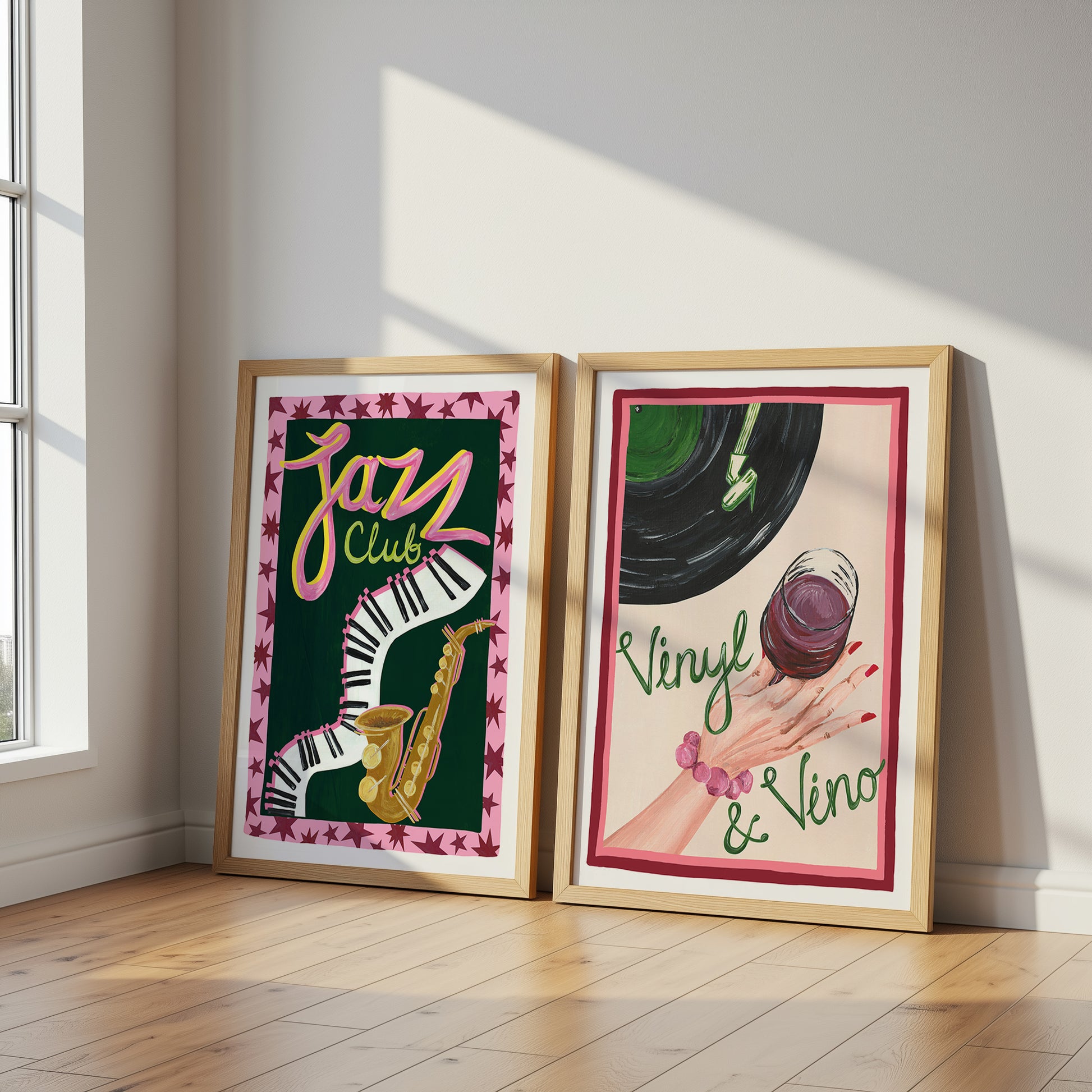Two framed artworks on a wall with a window in the background