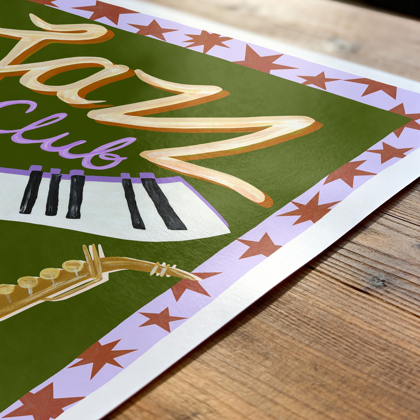 Decorative poster with 'Jazz Club' text and saxophone on a wooden surface