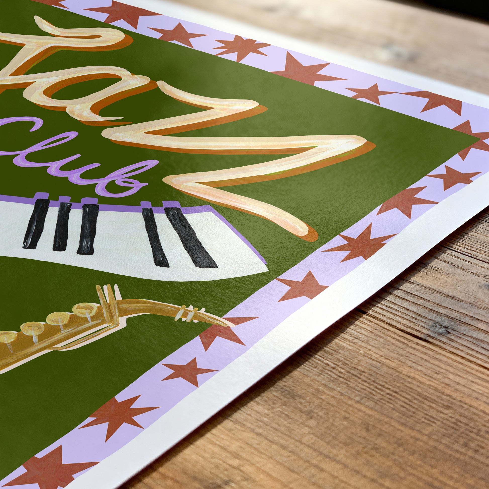 Decorative poster with 'Jazz Club' text and saxophone on a wooden surface
