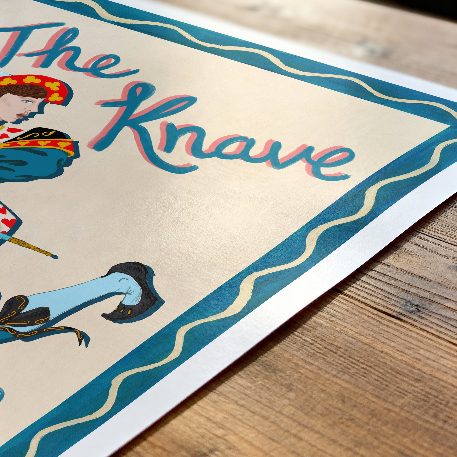 close up of a knave of heart illustration on a wooden table