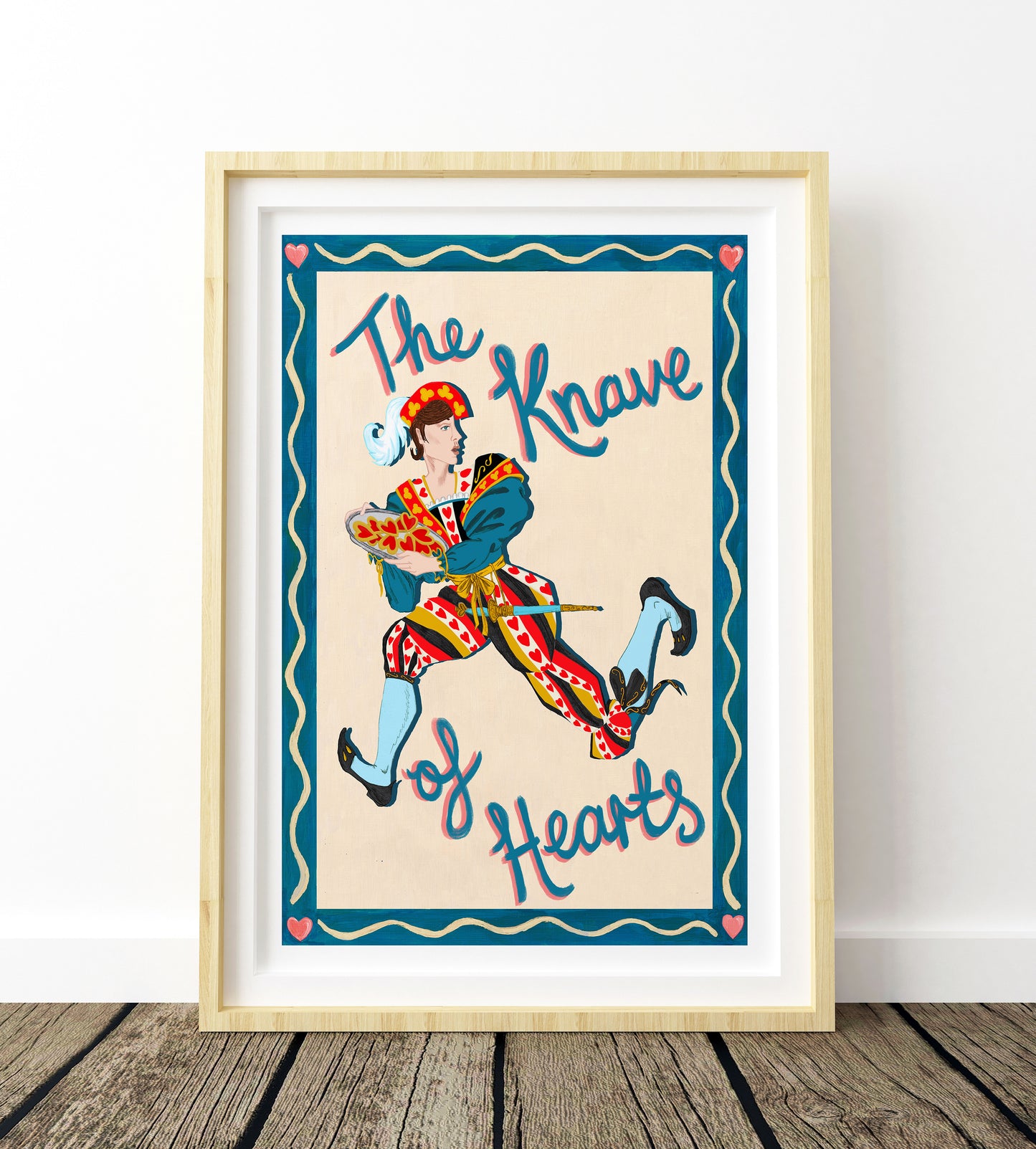 The Knave of hearts illustration in a light wood frame