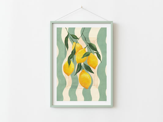 Framed artwork with lemons and leaves on a striped background, hanging on a white wall.