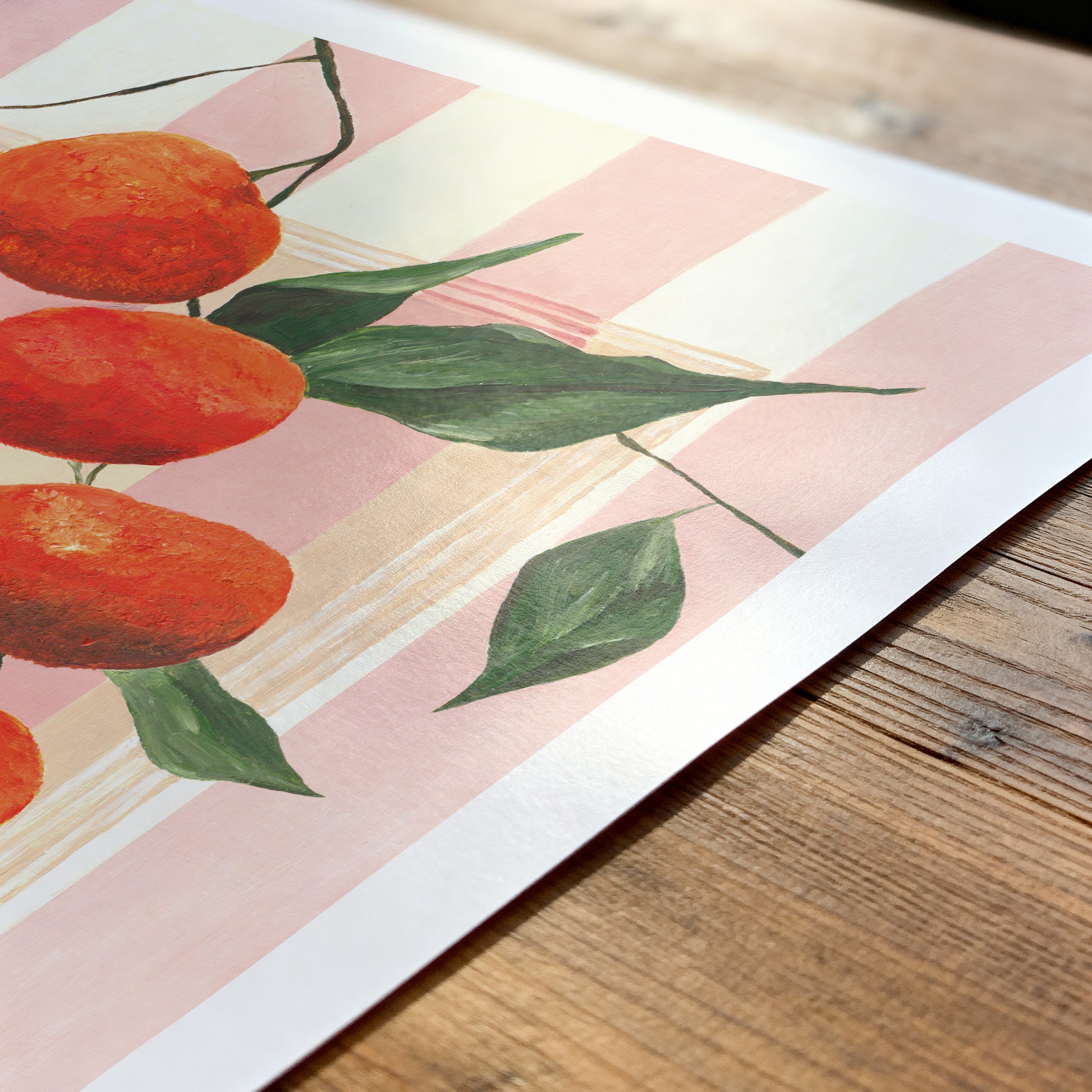 Art print of oranges and leaves on a wooden surface