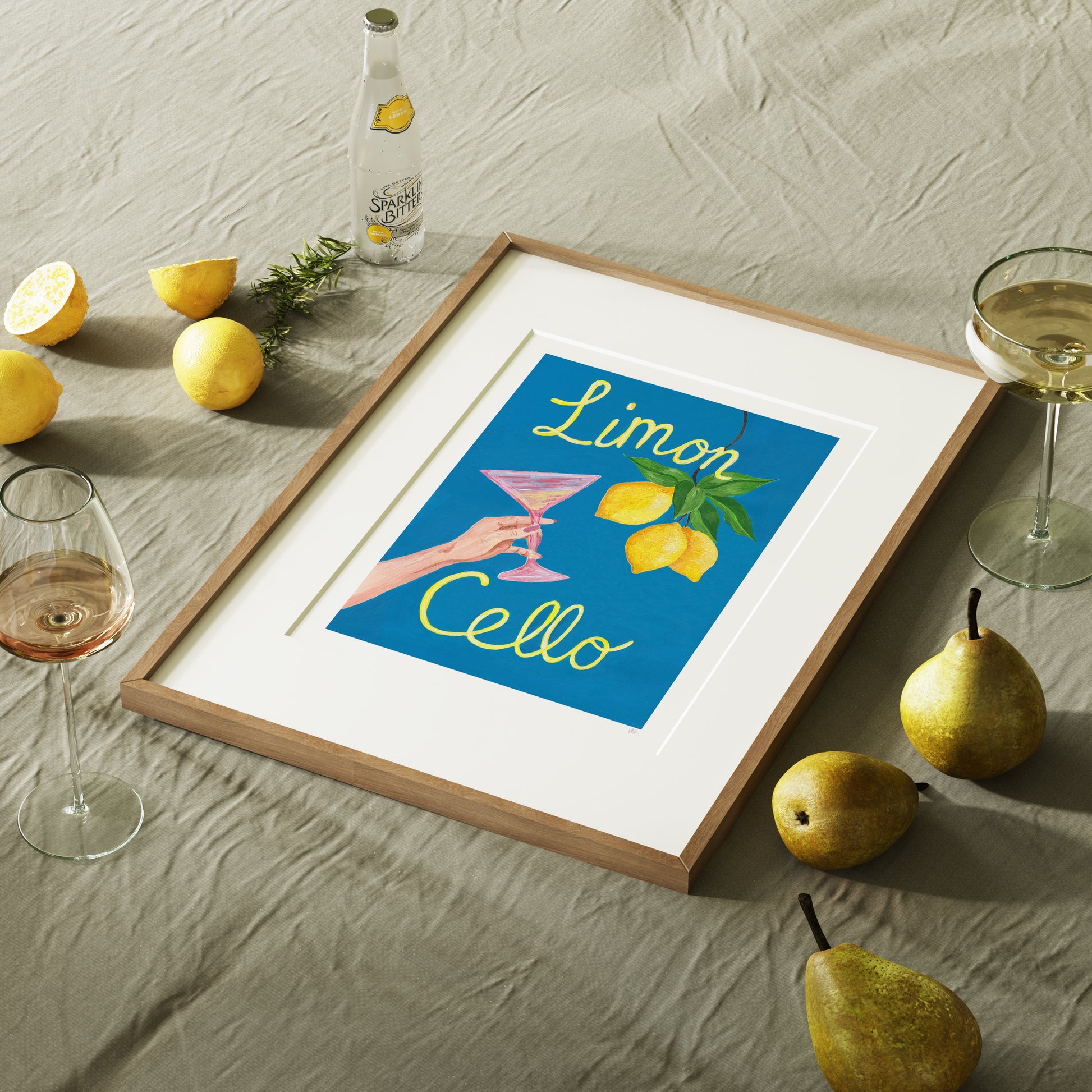 Framed artwork with 'Limon Cello' text on a table with lemons and pears.