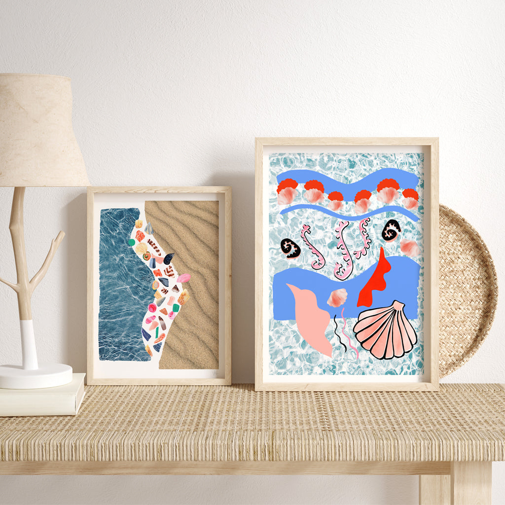 Framed abstract art prints on a wooden shelf with a lamp and decorative items.