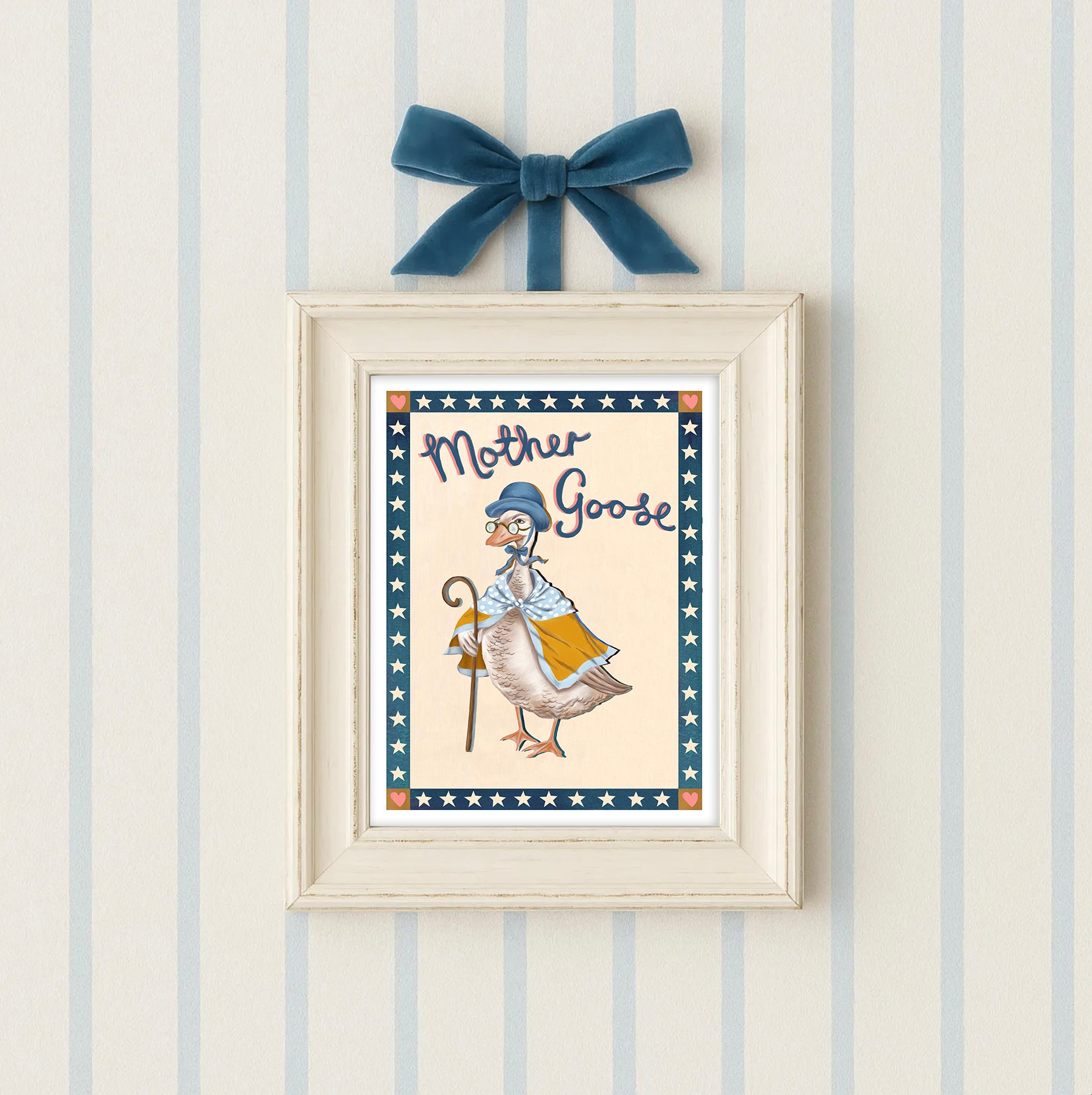 Framed artwork of 'Mother Goose' with a blue bow on a striped wall.