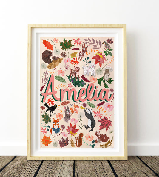 Framed artwork with 'Amelia' and nature-themed illustrations on a white wall.