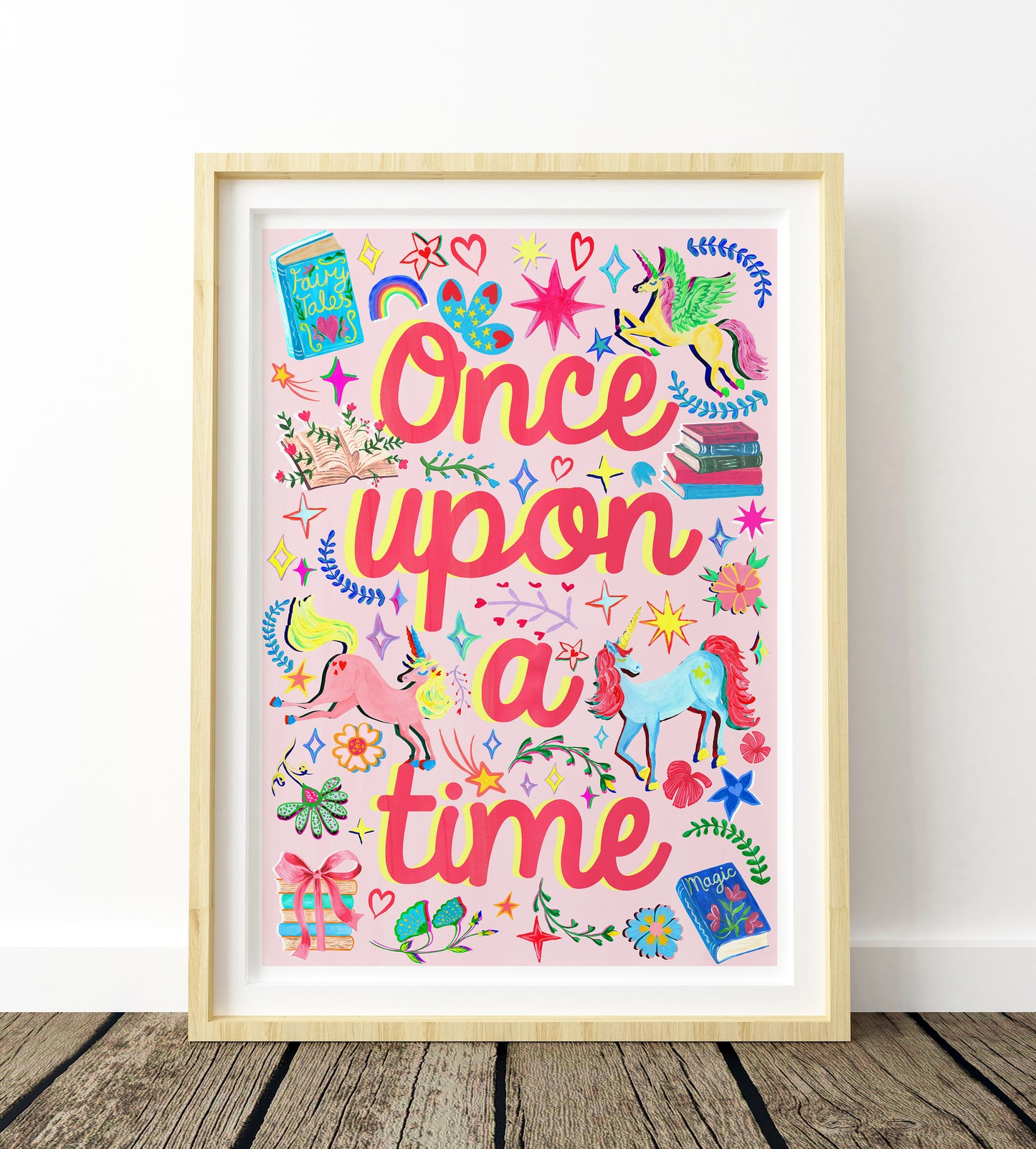 Framed artwork with 'Once upon a time' text and colorful illustrations on a white background.