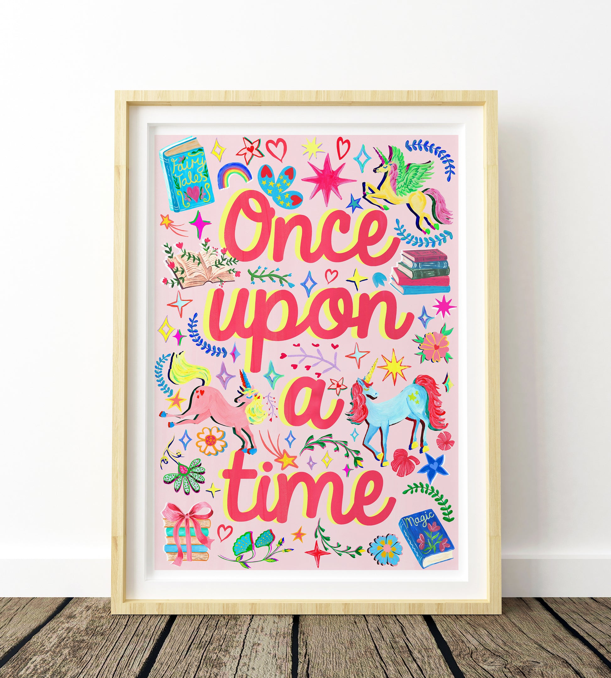 Framed artwork with 'Once upon a time' text and colorful illustrations on a white background.