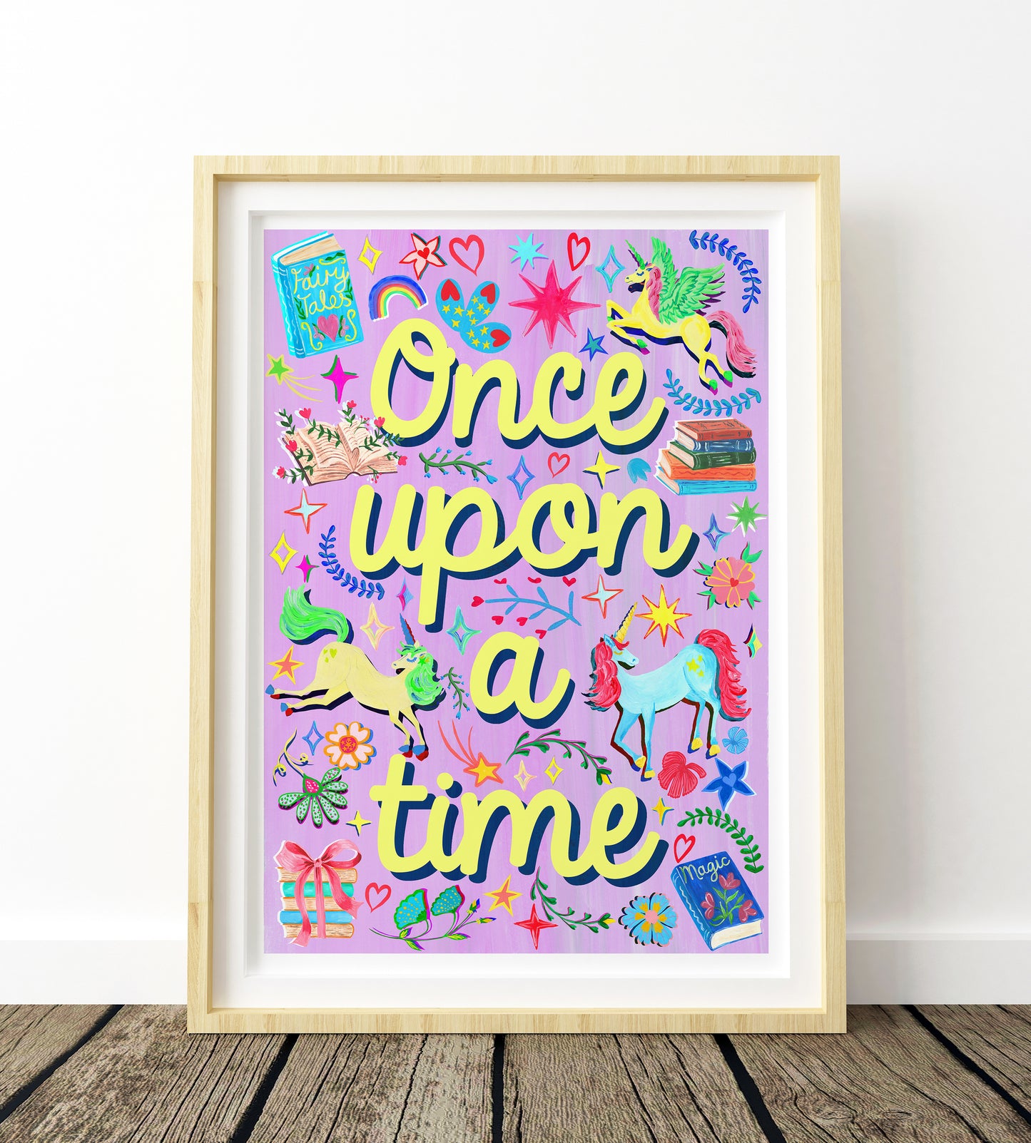 Framed artwork with 'Once upon a time' text and colorful illustrations on a purple background.