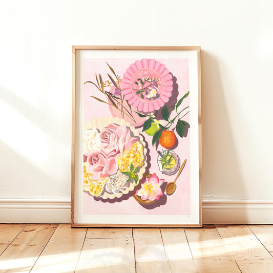 Framed floral artwork on a light pink background with wooden frame