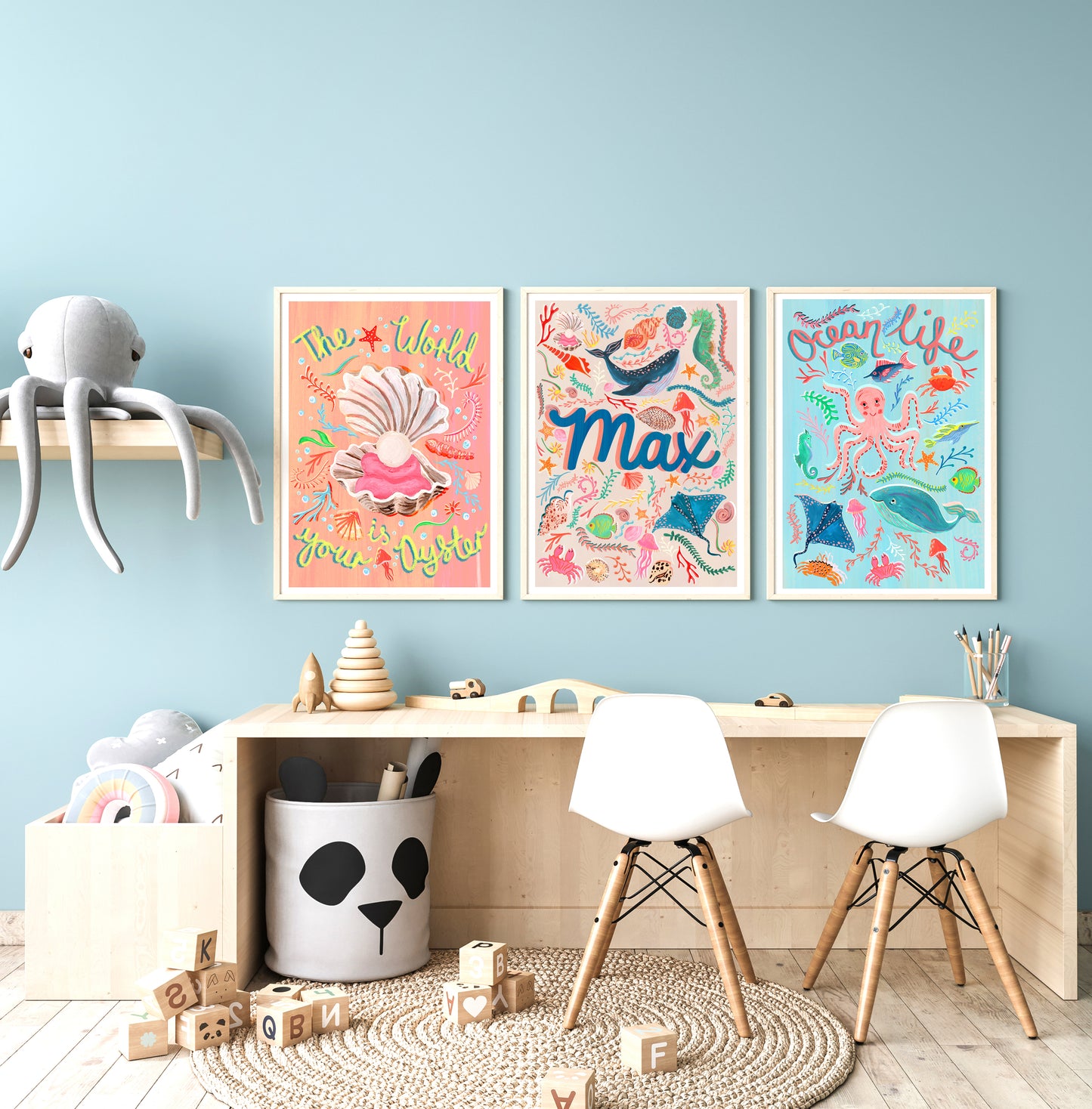 Children's room with colorful wall art, furniture, and toys against a light blue wall.