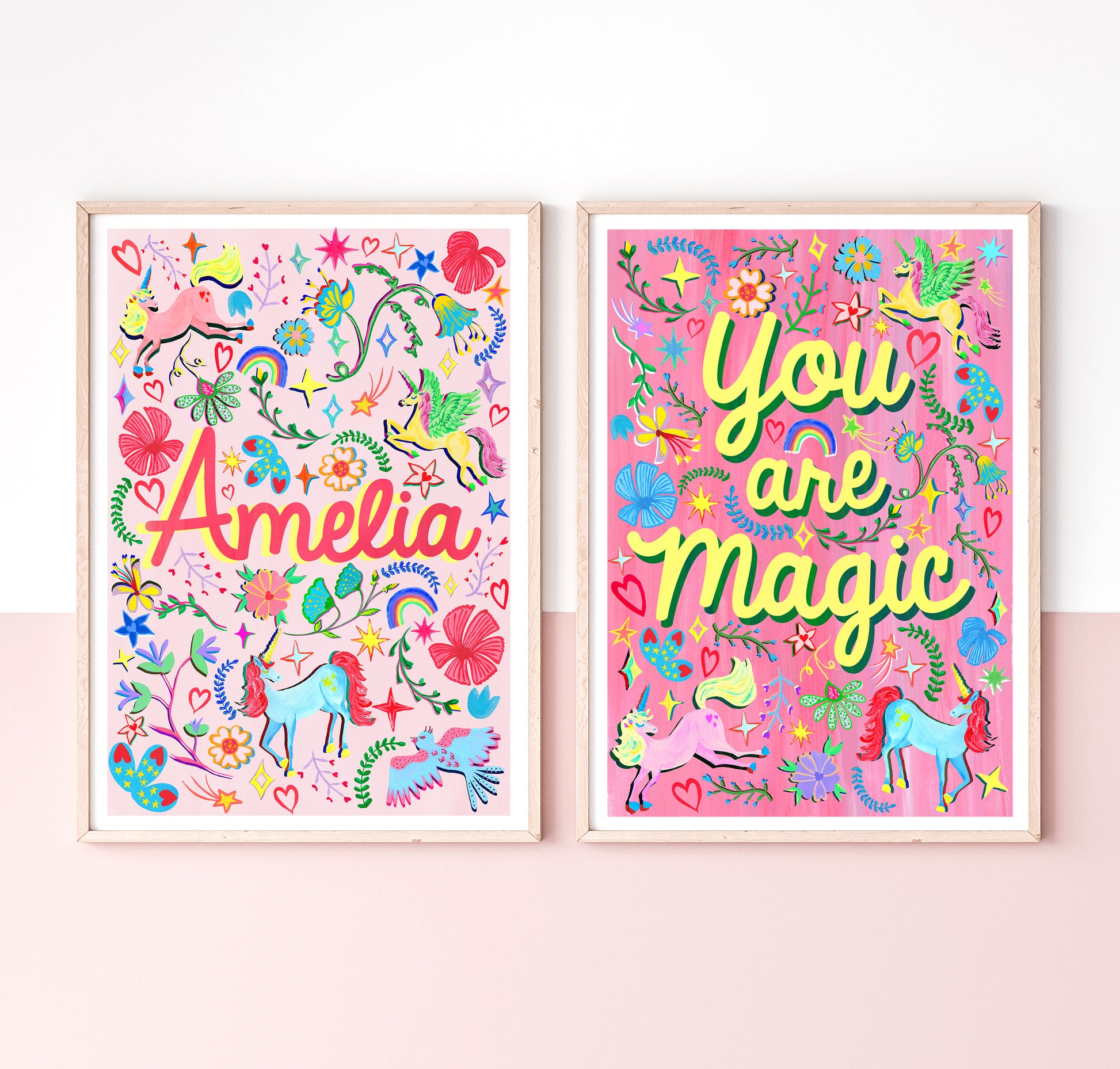 Two colorful children's posters with 'Amelia' and 'You are Magic' text on a pink background.