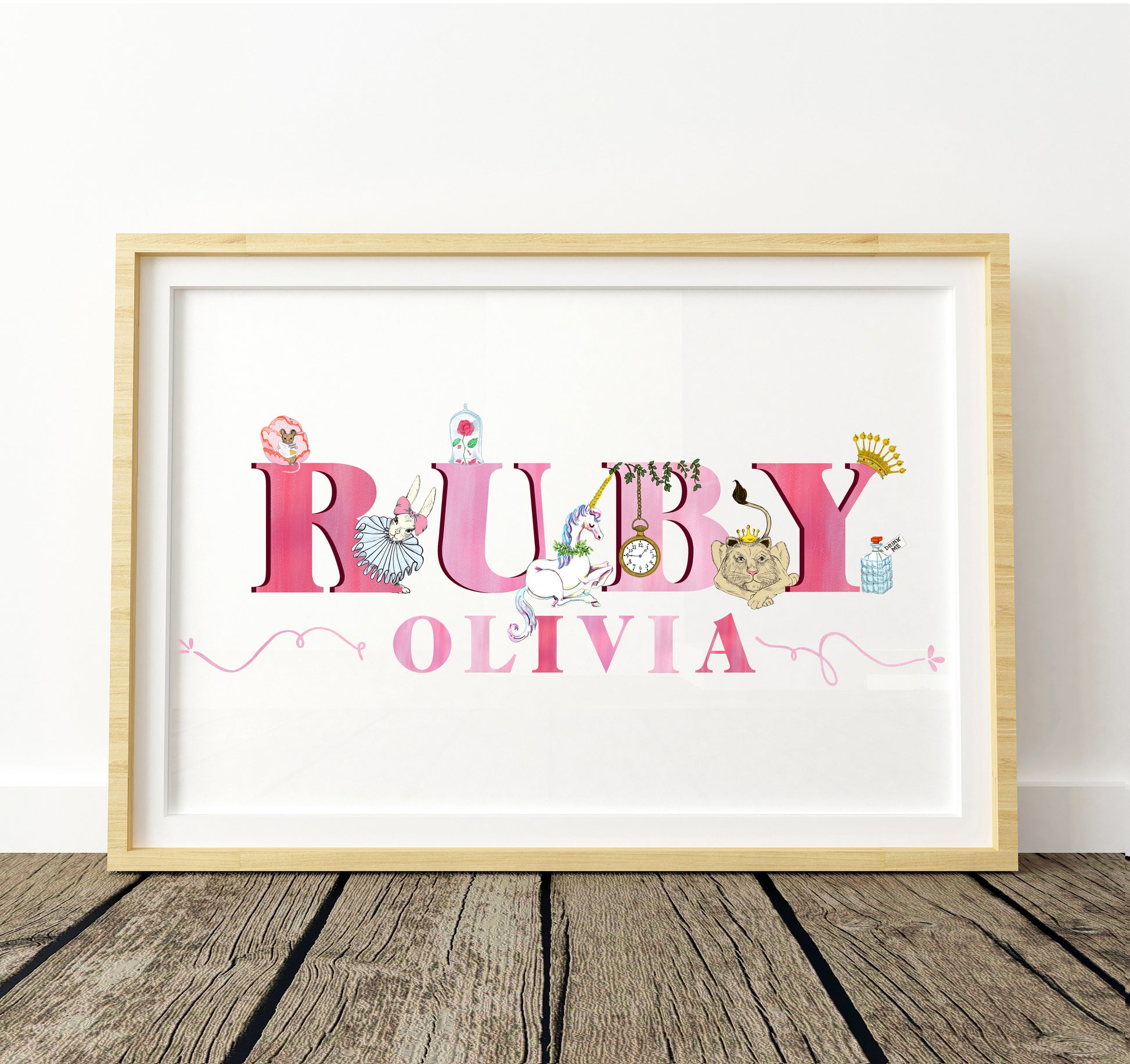 Framed artwork with 'RUBY OLIVIA' in fairytale illustration decorative letters on a white background