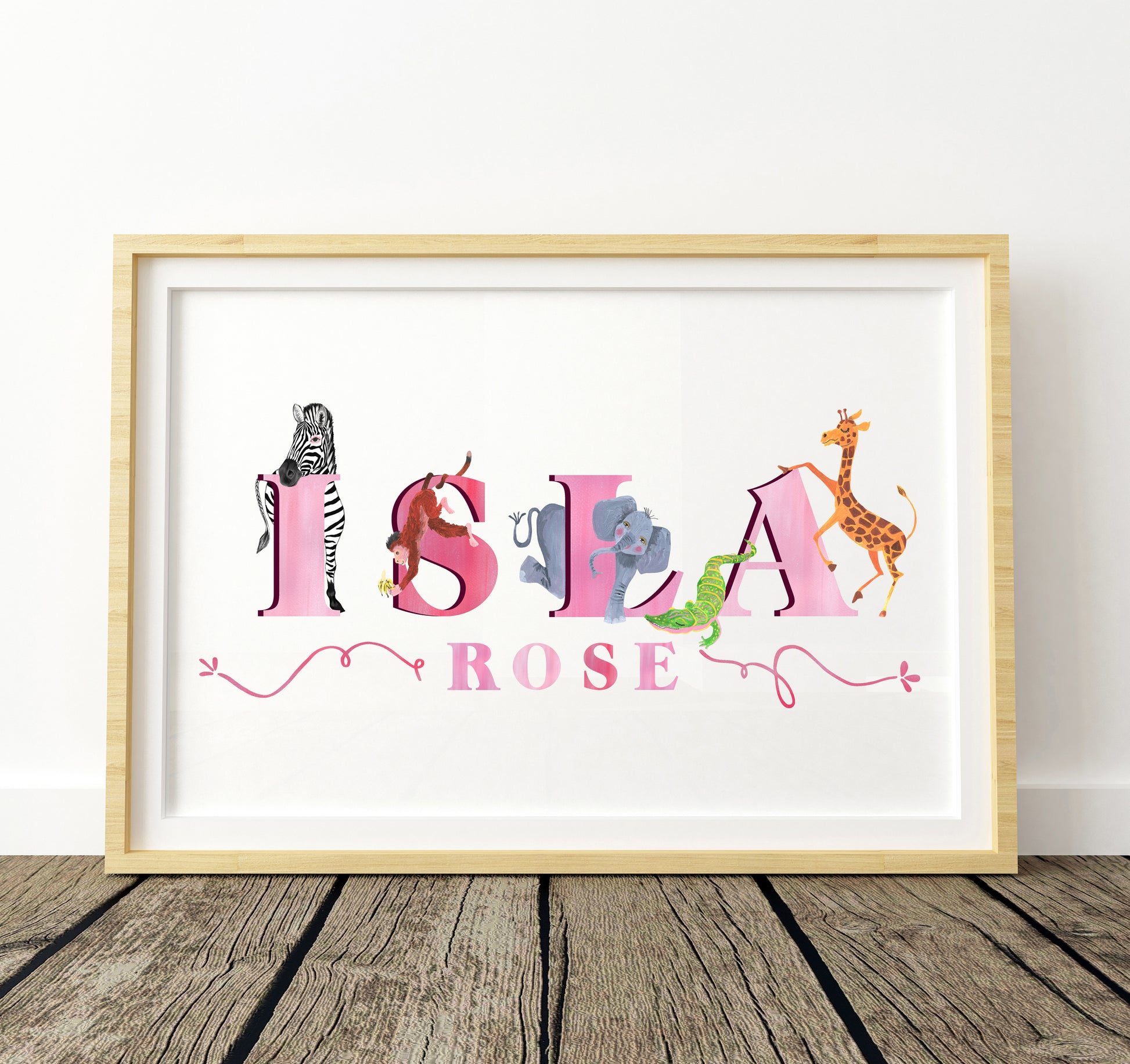 Framed artwork with colorful safari animal illustrations and 'Isla Rose' text on a white background.