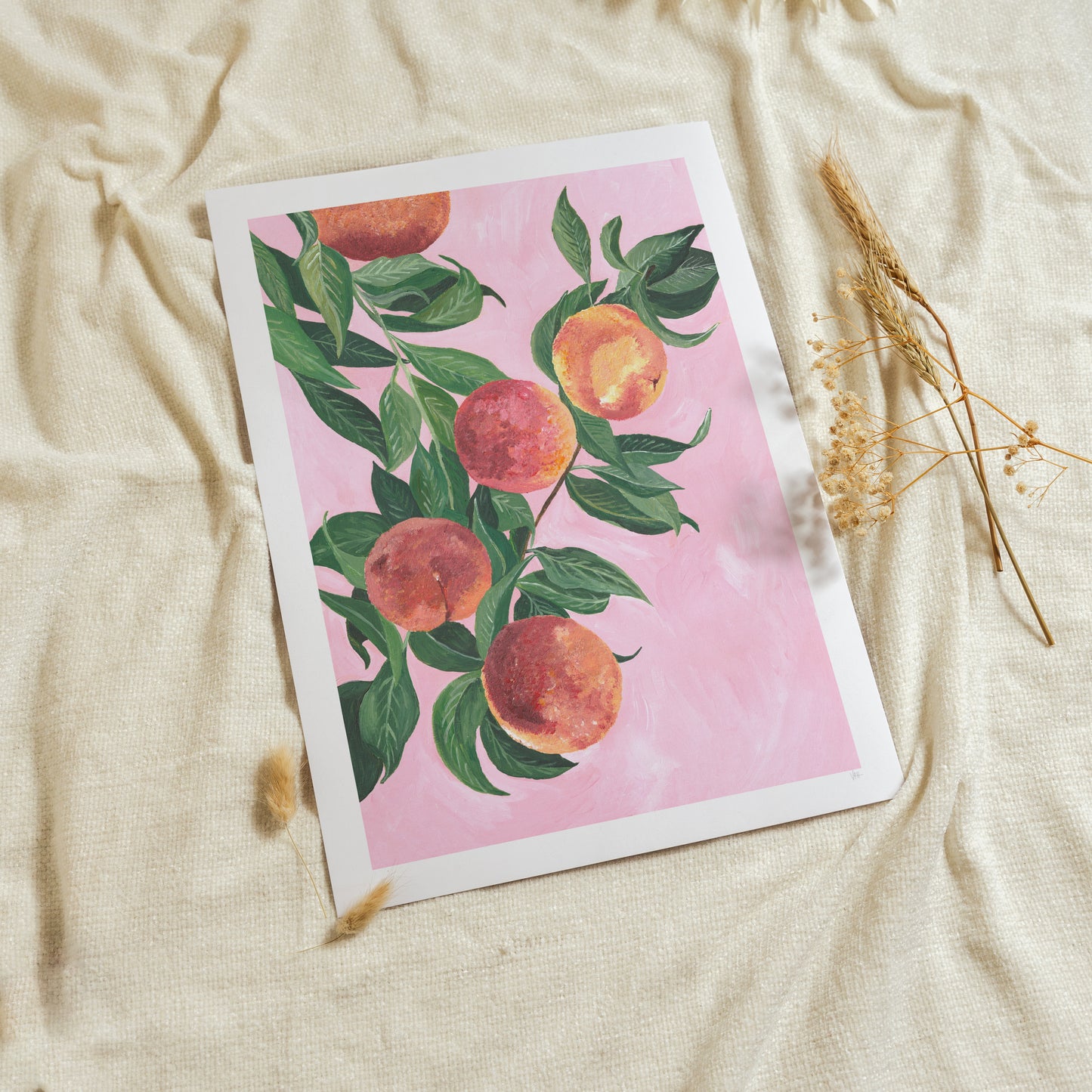 Card with peach illustration on a pink background, placed on a textured beige surface.