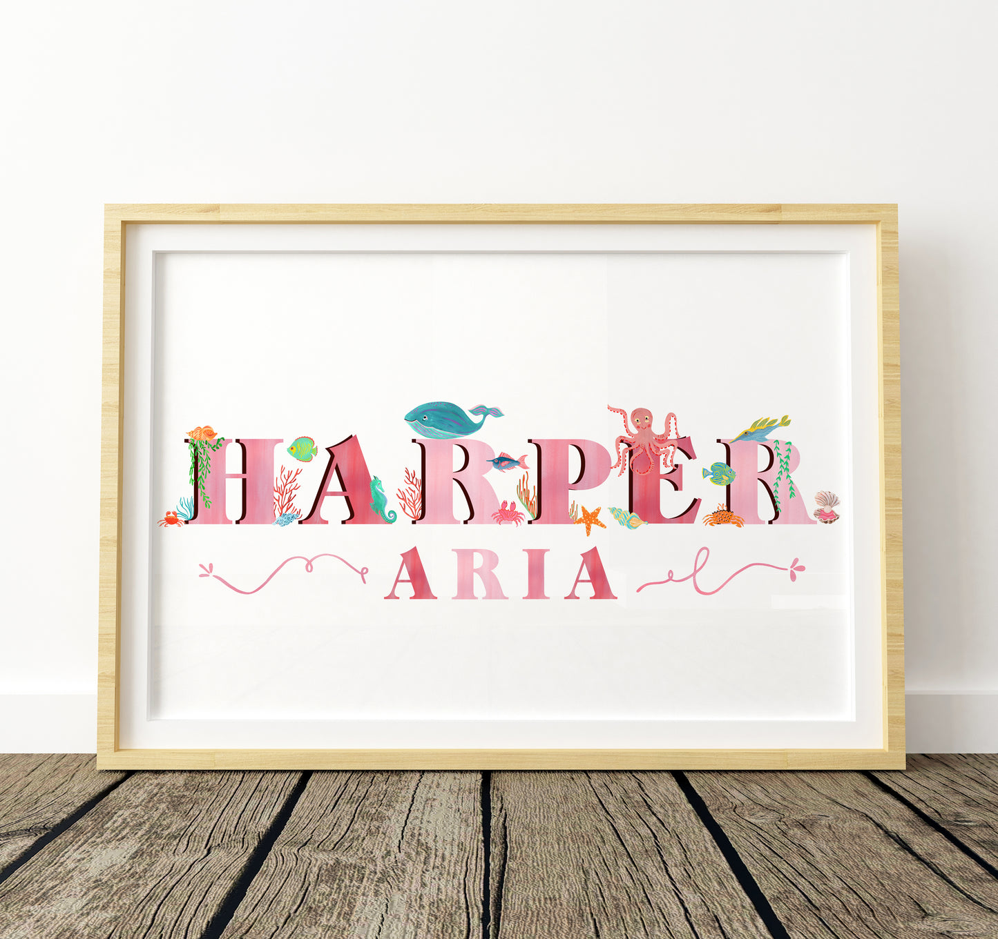 Framed artwork with 'Harper Aria' with  sea animal illustrations on a white background