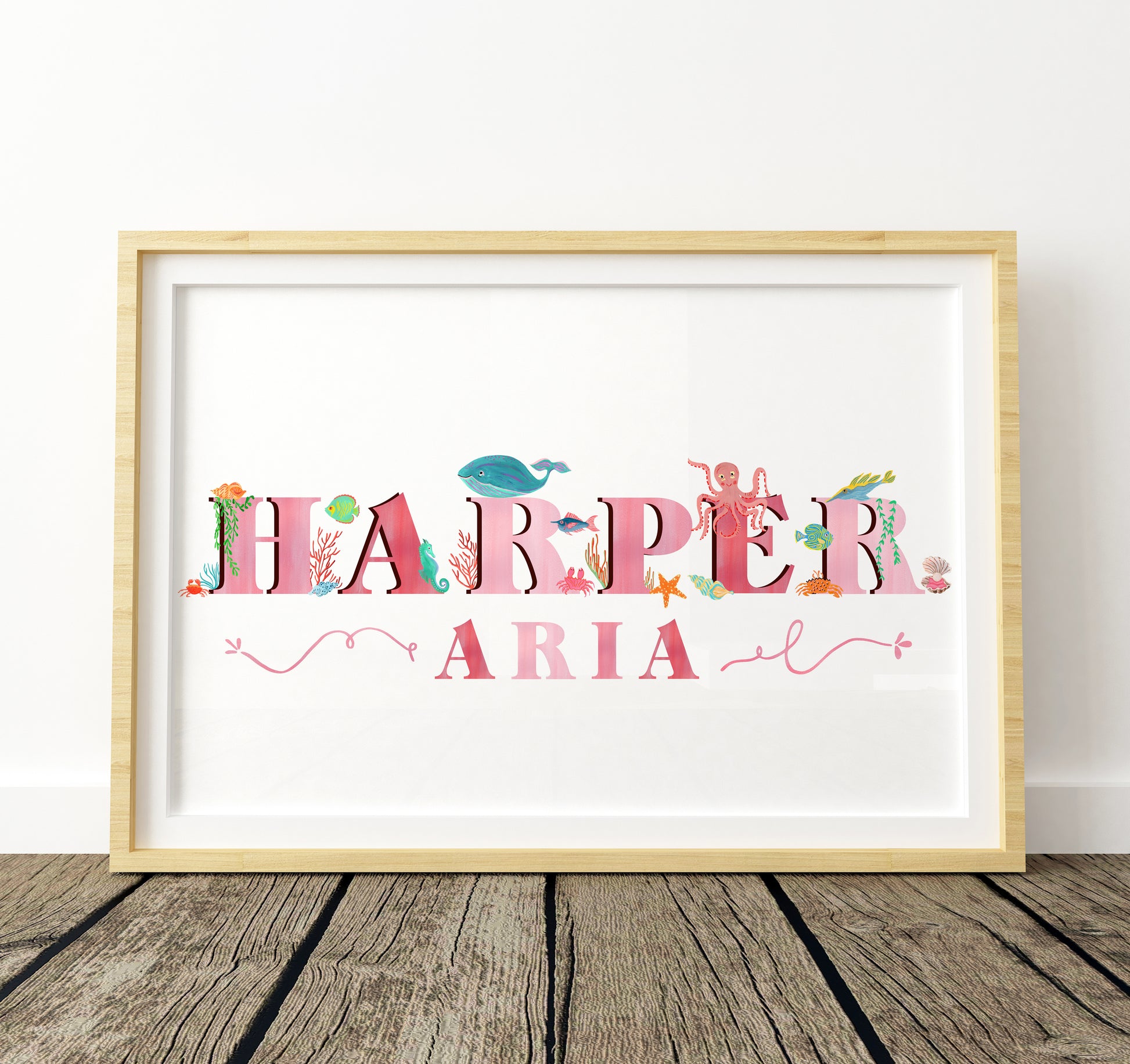 Framed artwork with 'Harper Aria' with  sea animal illustrations on a white background