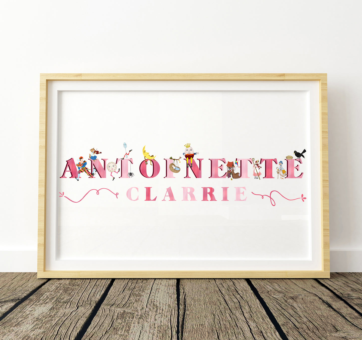 Framed artwork with colorful pink text and decorative nursery rhyme illustrations on a white background