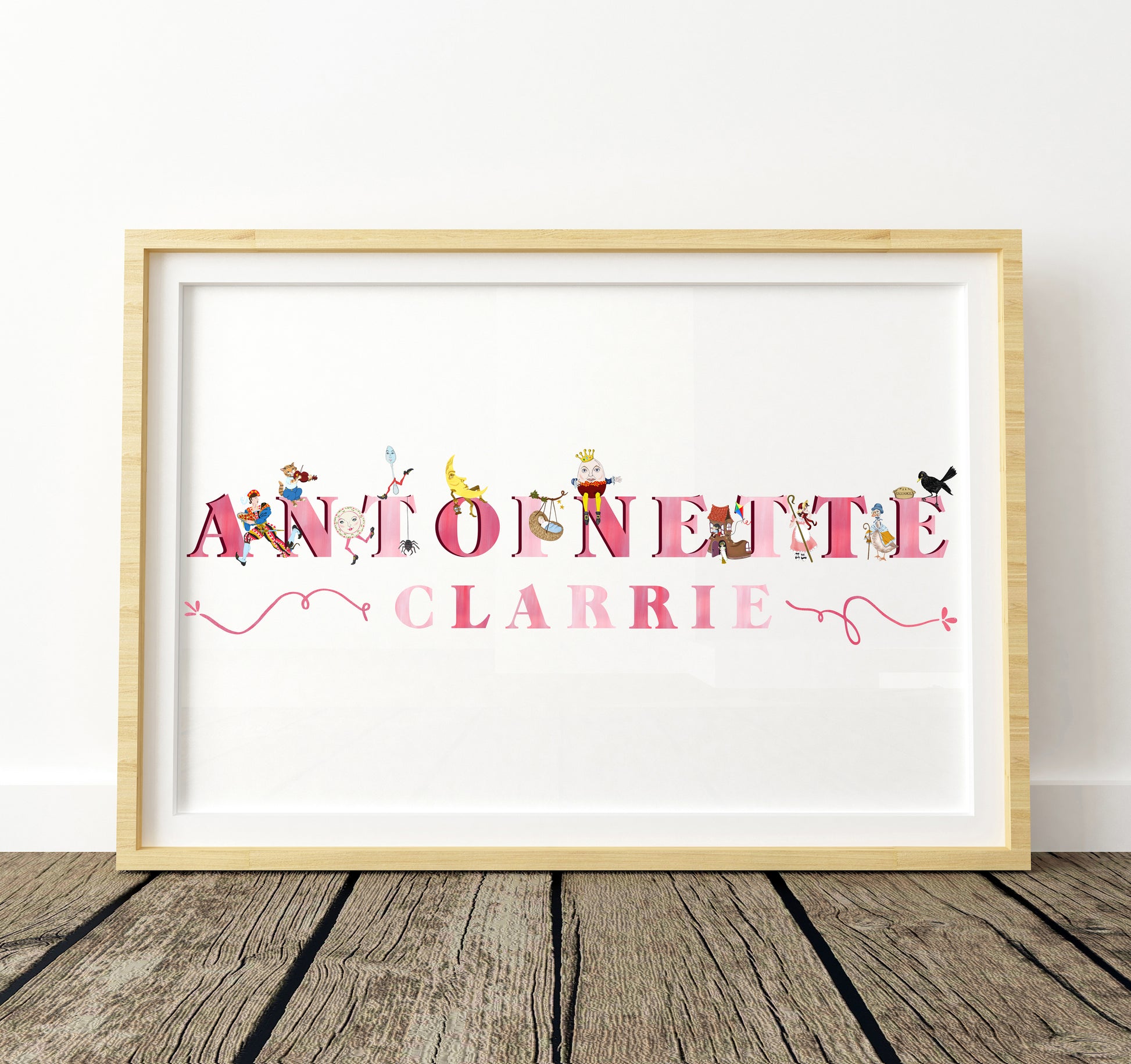 Framed artwork with colorful pink text and decorative nursery rhyme illustrations on a white background