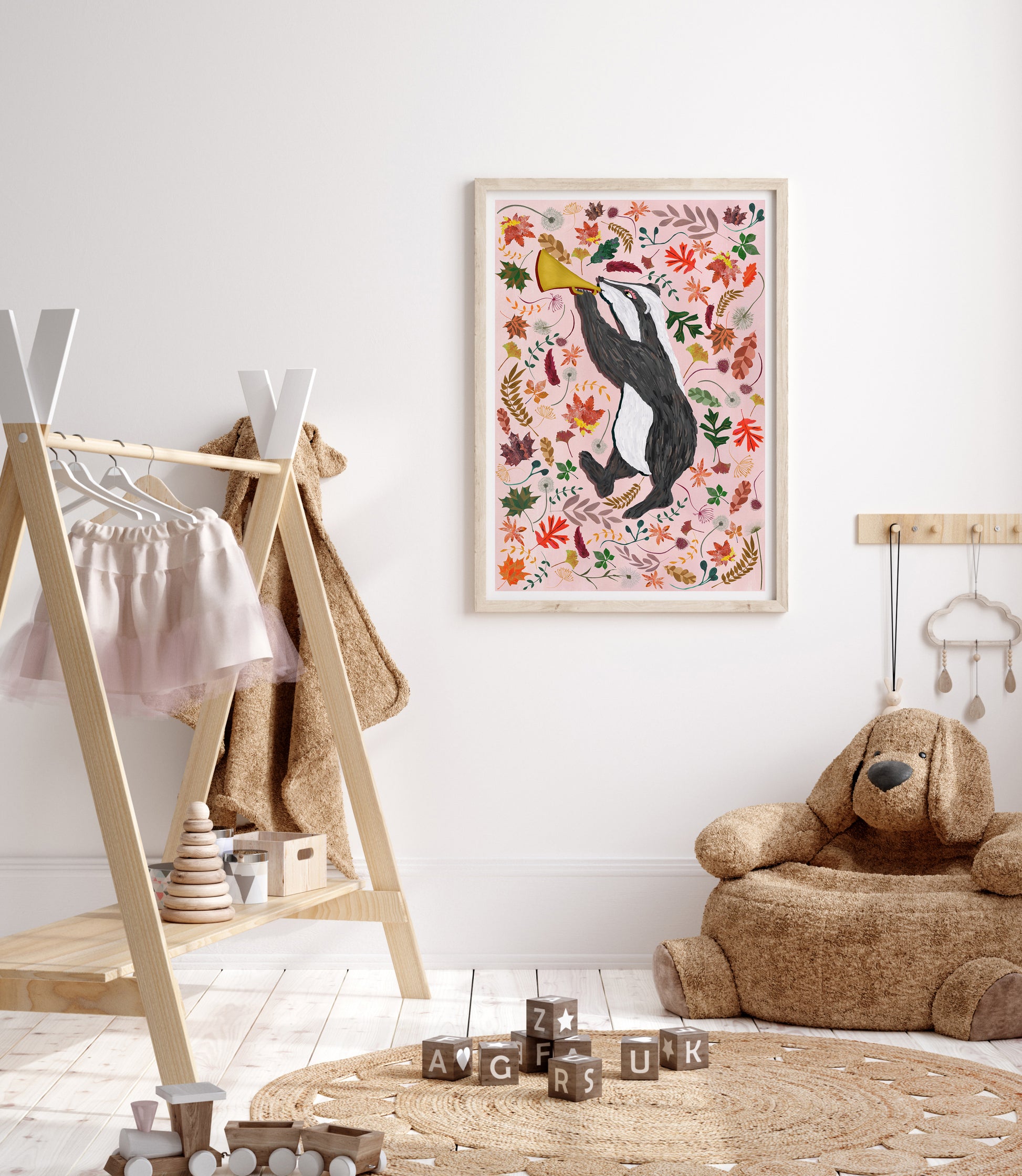 Children's room with a penguin illustration on the wall, wooden shelf, and teddy bear chair.
