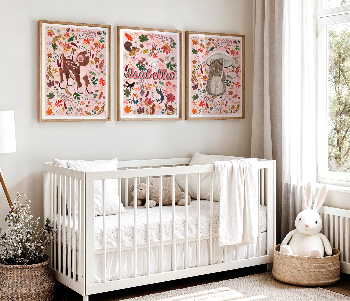 Nursery room with a white crib, hand painted woodland animal surround by autmn leaf illustatrions and a name print, and decorative items.