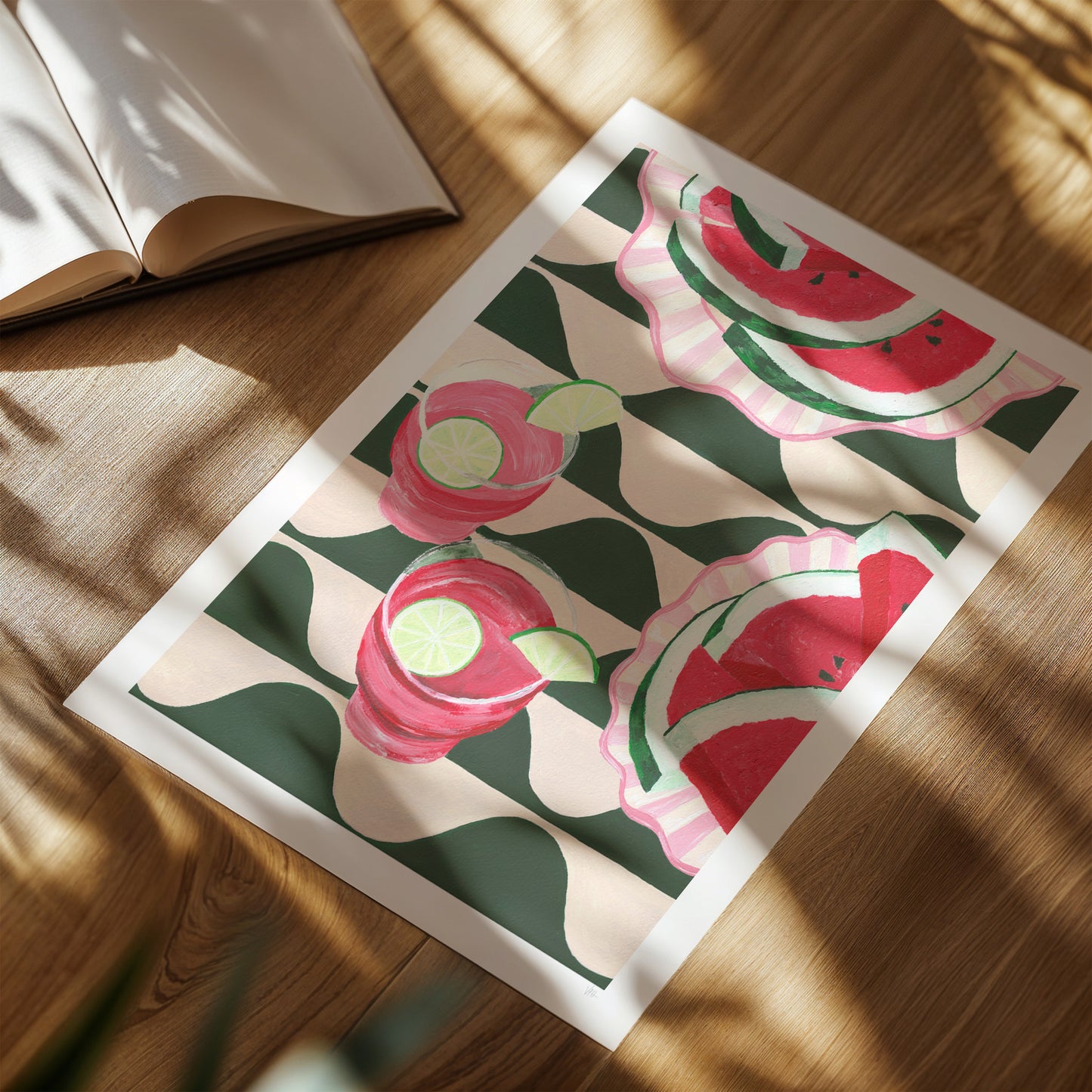 Framed artwork with watermelon and flower pattern on a wooden surface