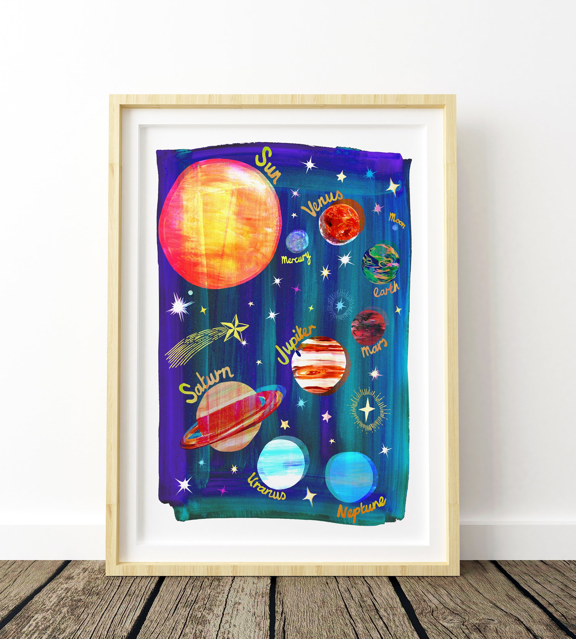 Framed artwork of colorful planets and stars on a purple background
