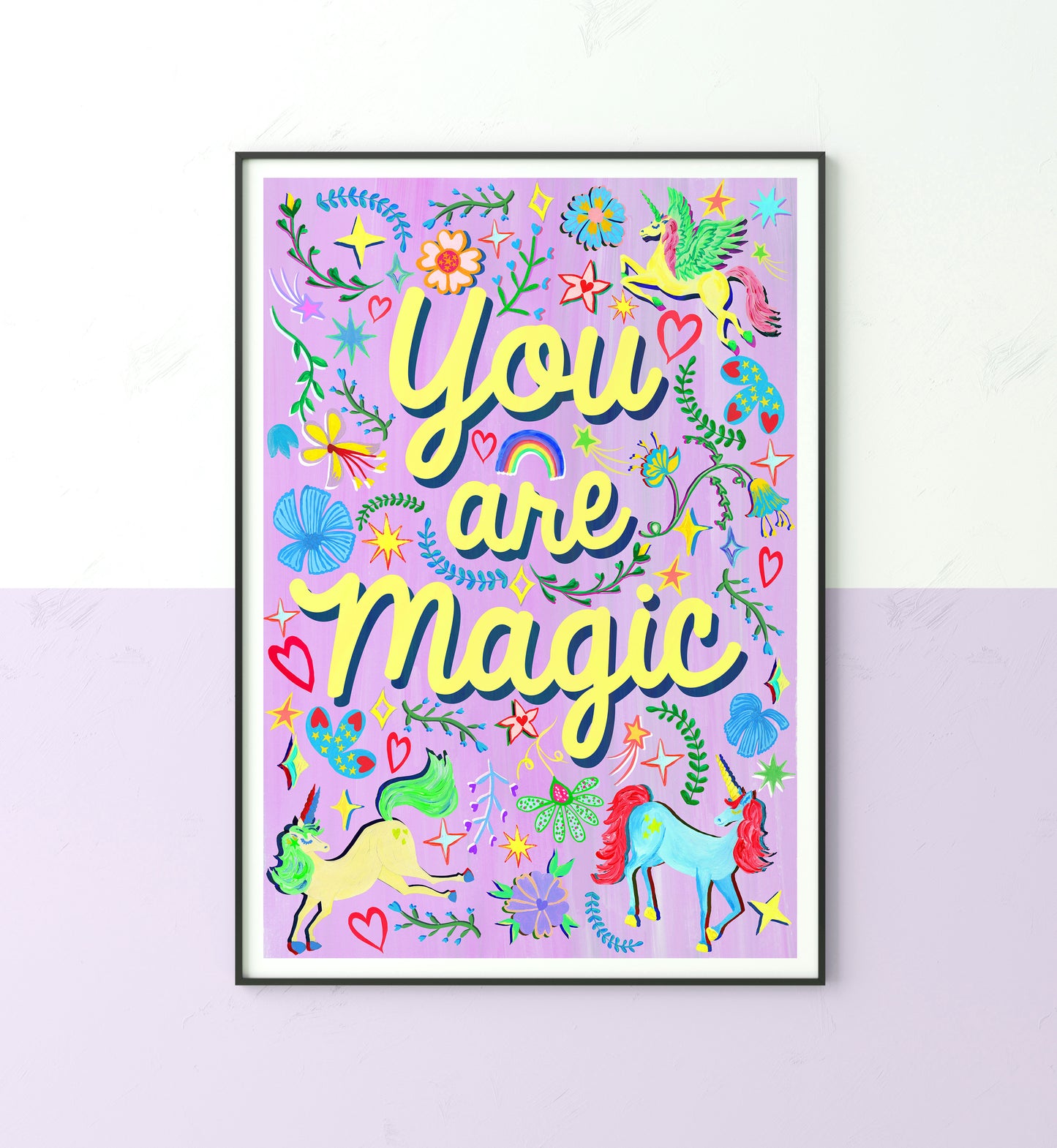 A colourful illustration of the words 'you are magic' surrounded with unicorn, flower and rainbow illustrations with a purple painted background.