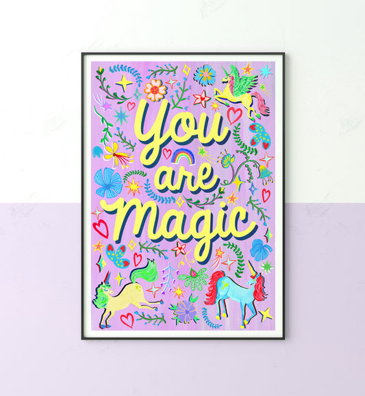 A colourful illustration of the words 'you are magic' surrounded with unicorn, flower and rainbow illustrations with a purple painted background.