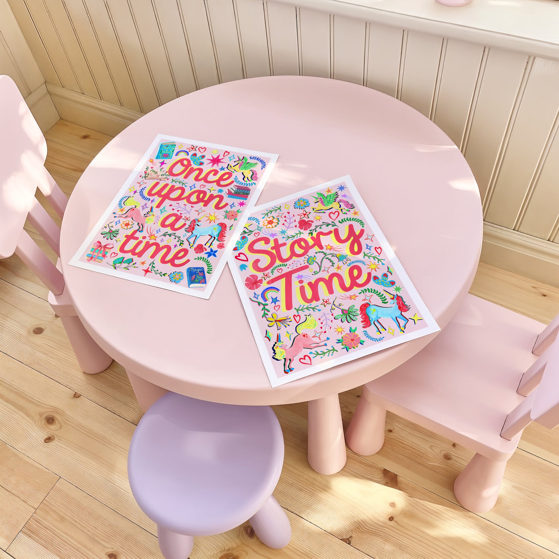 Children's table and chairs with 'Once upon a time' and 'Story Time' posters on a wooden floor.