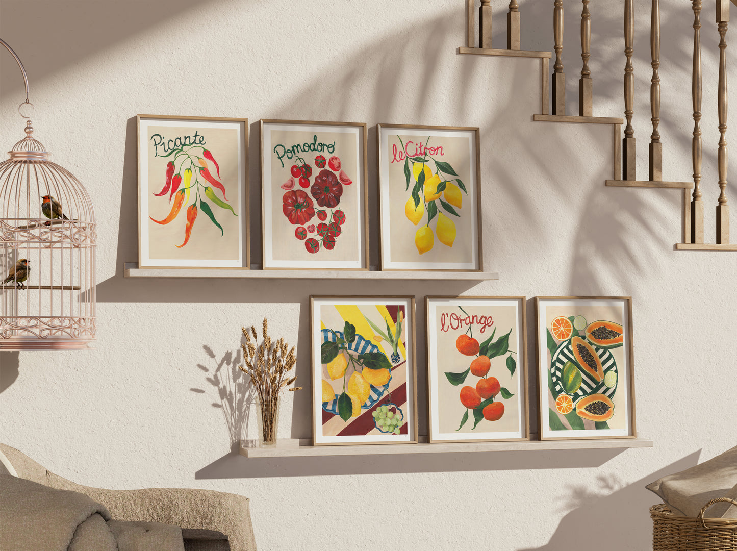 Decorative wall art prints on a wall with a staircase in the background