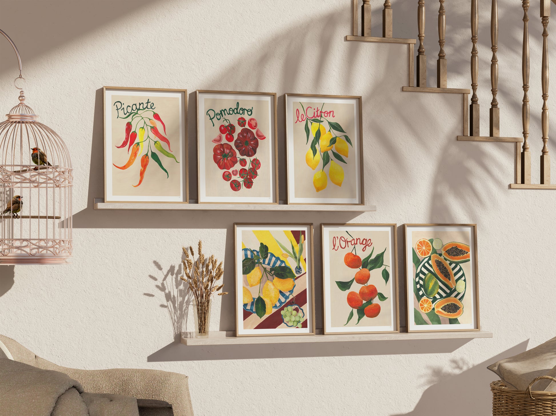 Decorative wall art prints on a wall with a staircase in the background
