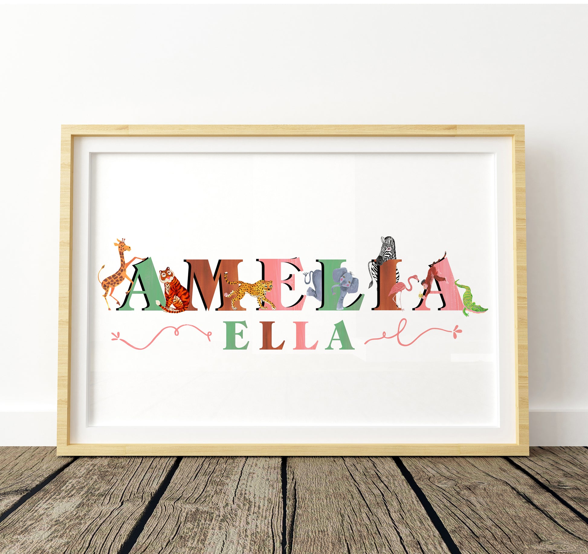 Framed artwork with colorful letters spelling 'Amelia Ella' on a white background