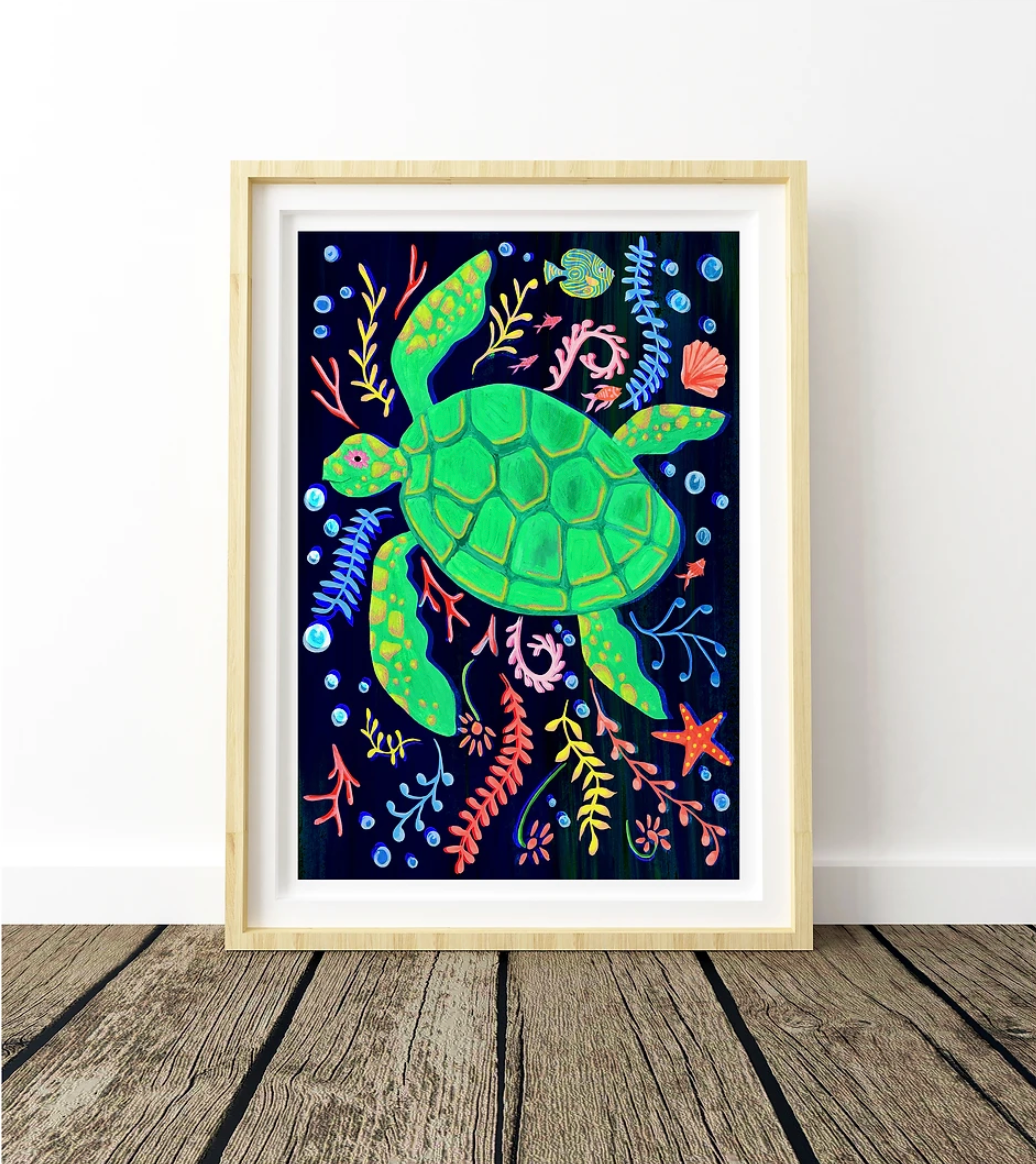 Framed artwork of a green turtle surrounded by colorful sea creatures on a dark background.
