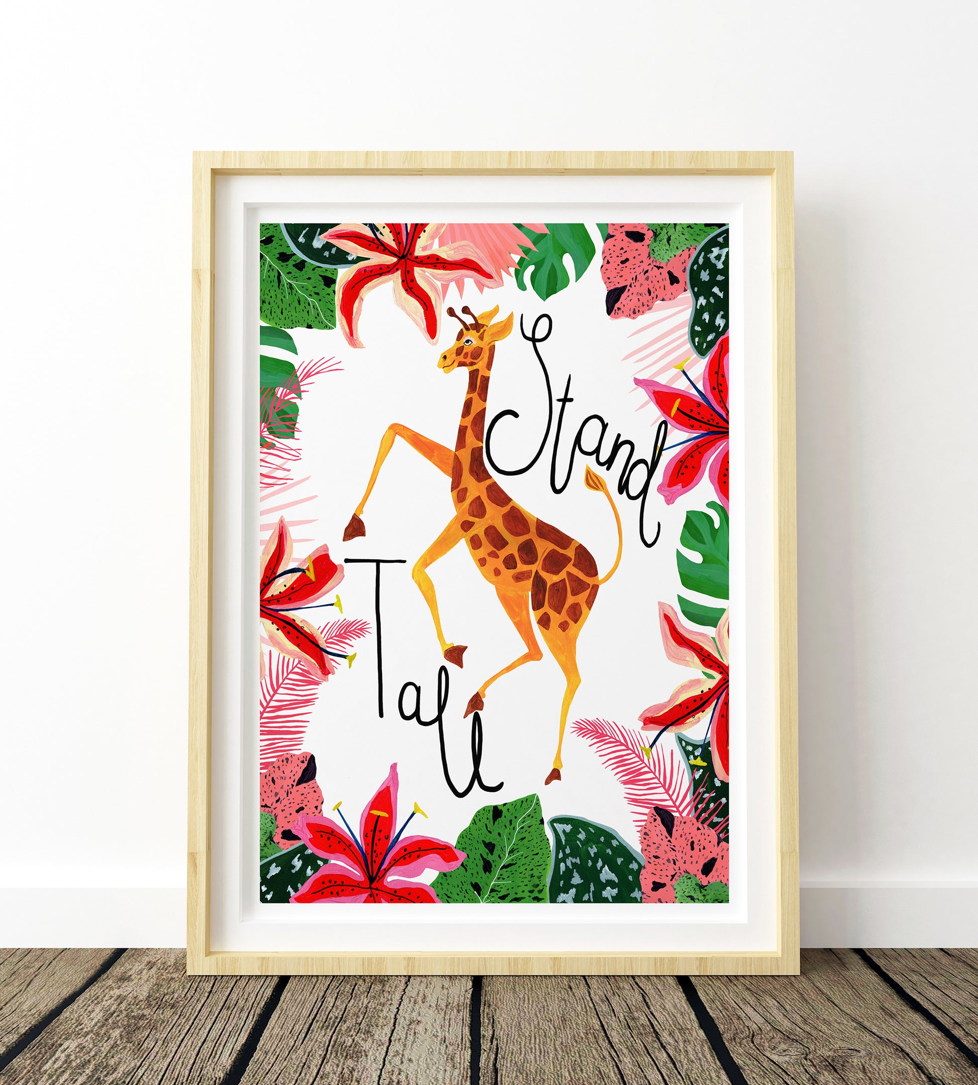 Framed artwork with a giraffe and floral design on a white background