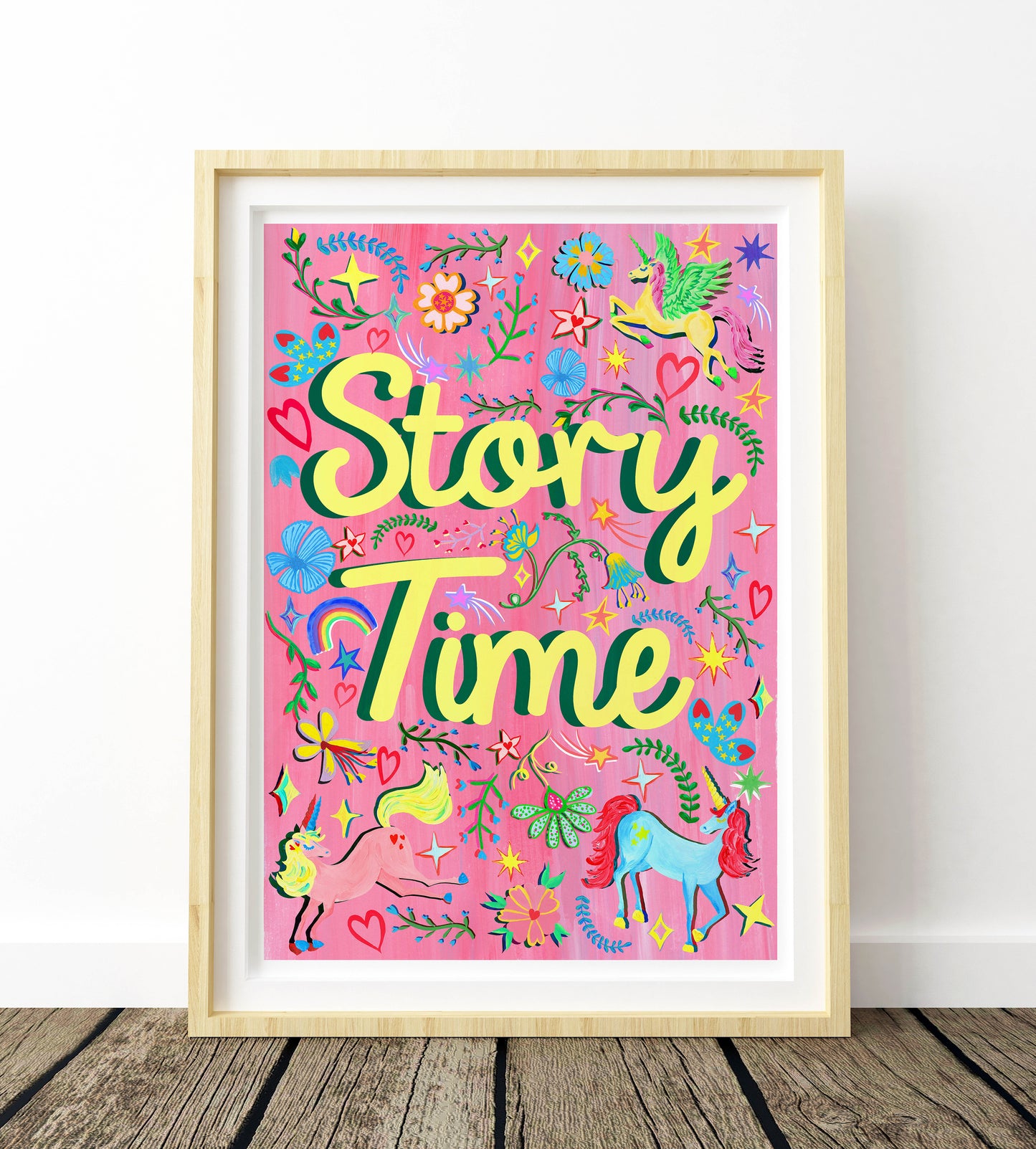 Framed artwork with 'Story Time' text and colorful illustrations on a pink background.