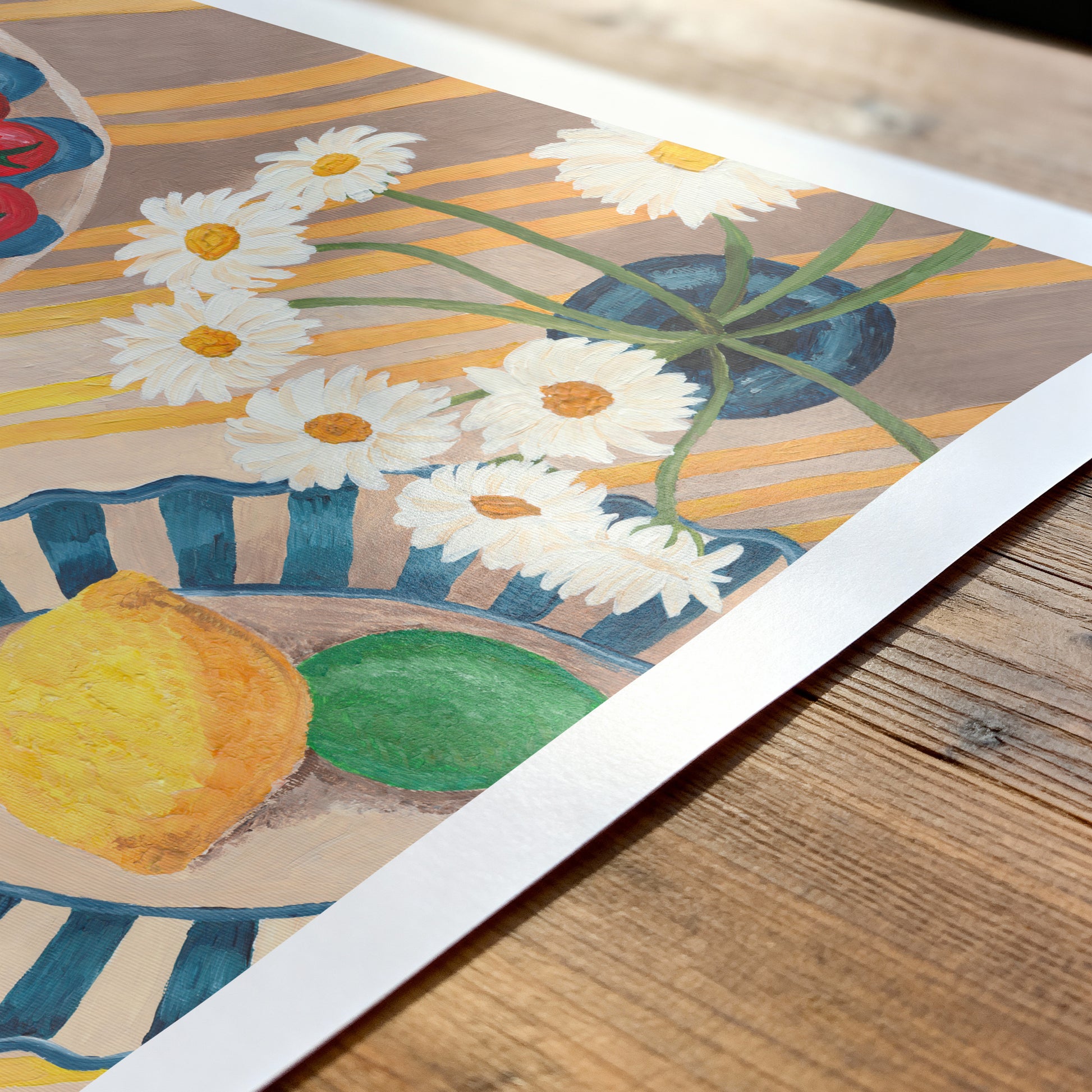 Artistic depiction of flowers and fruits on a wooden surface