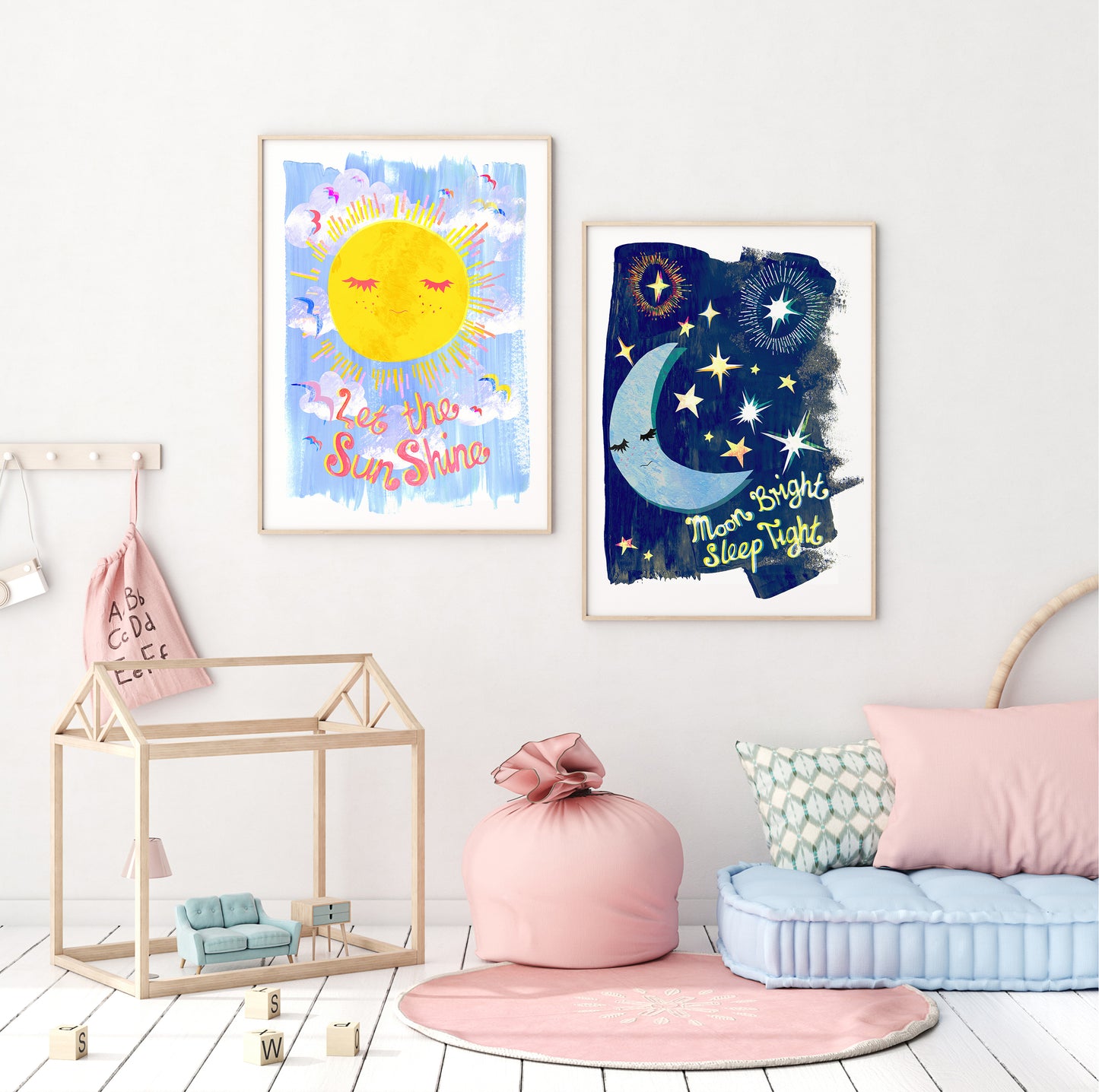 Children's room with wall art of a sun and moon, pink cushion, and blue chair.