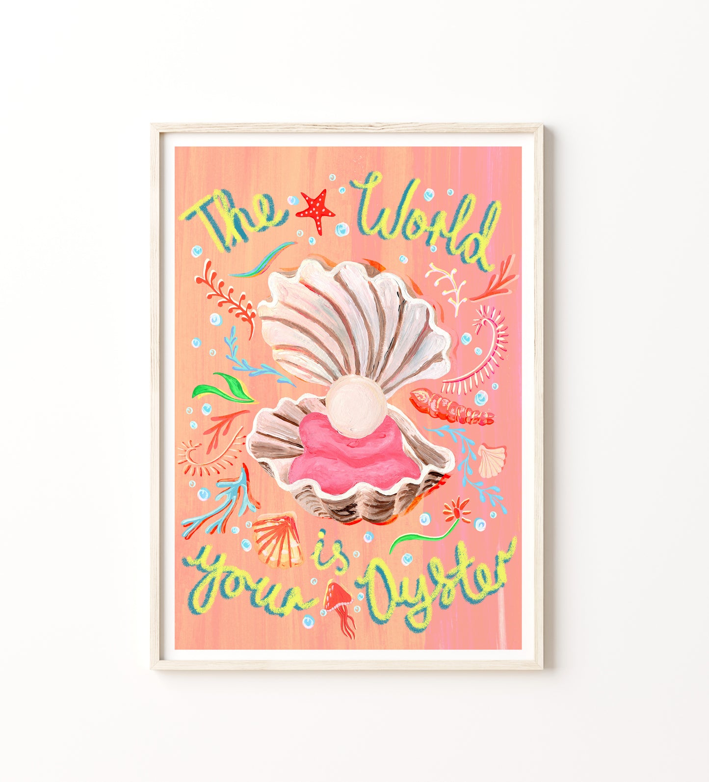 Framed artwork with shells and colorful text on a pink background
