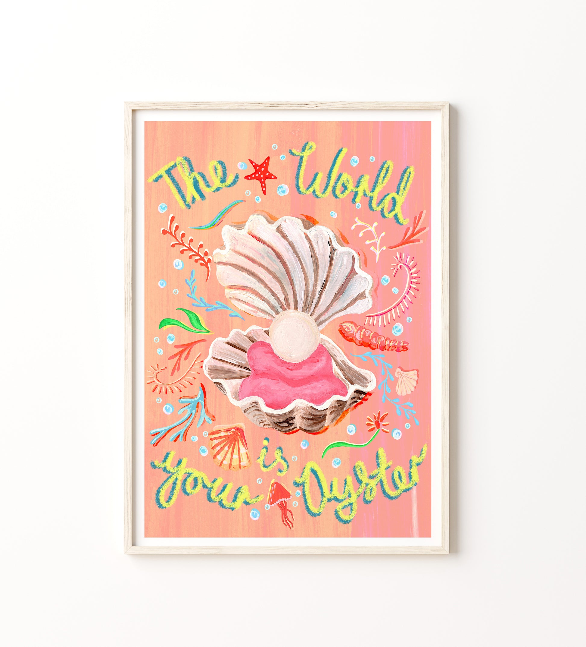 Framed artwork with shells and colorful text on a pink background