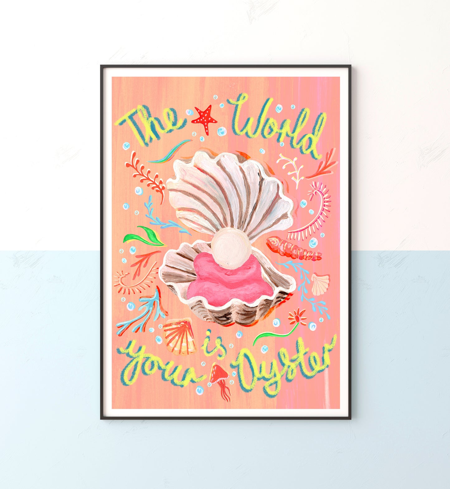 Framed artwork with seashells and colorful text on a peach background
