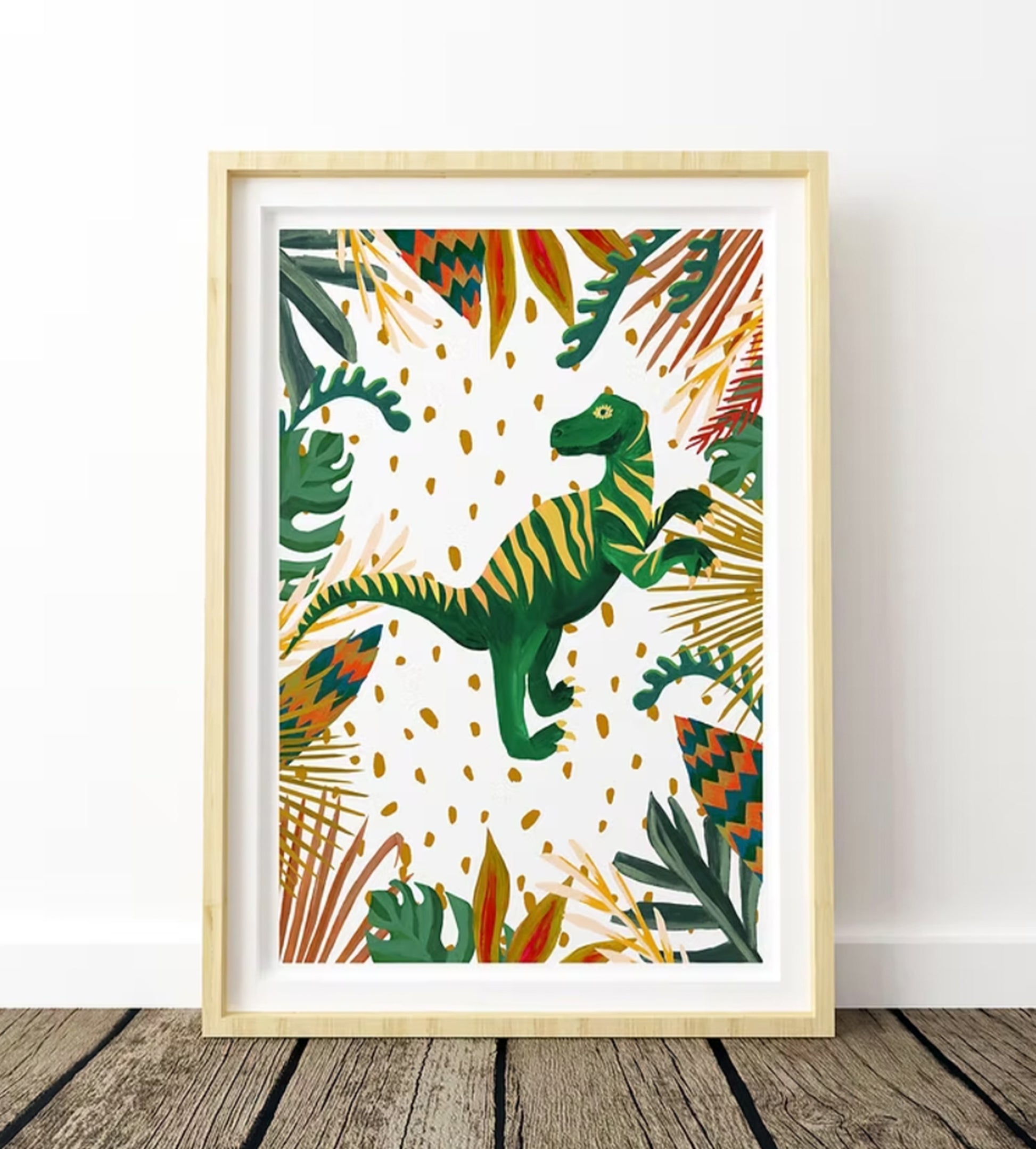 Framed artwork with a dinosaur and tropical leaves on a white background