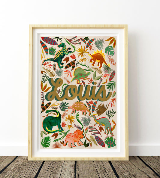 Framed artwork with colorful dinosaur illustrations and the name 'Louis' on a white background.
