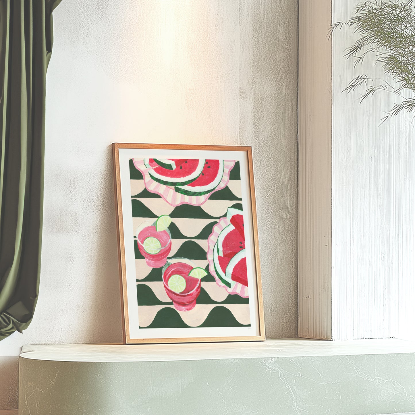 Framed artwork with watermelon design on a shelf