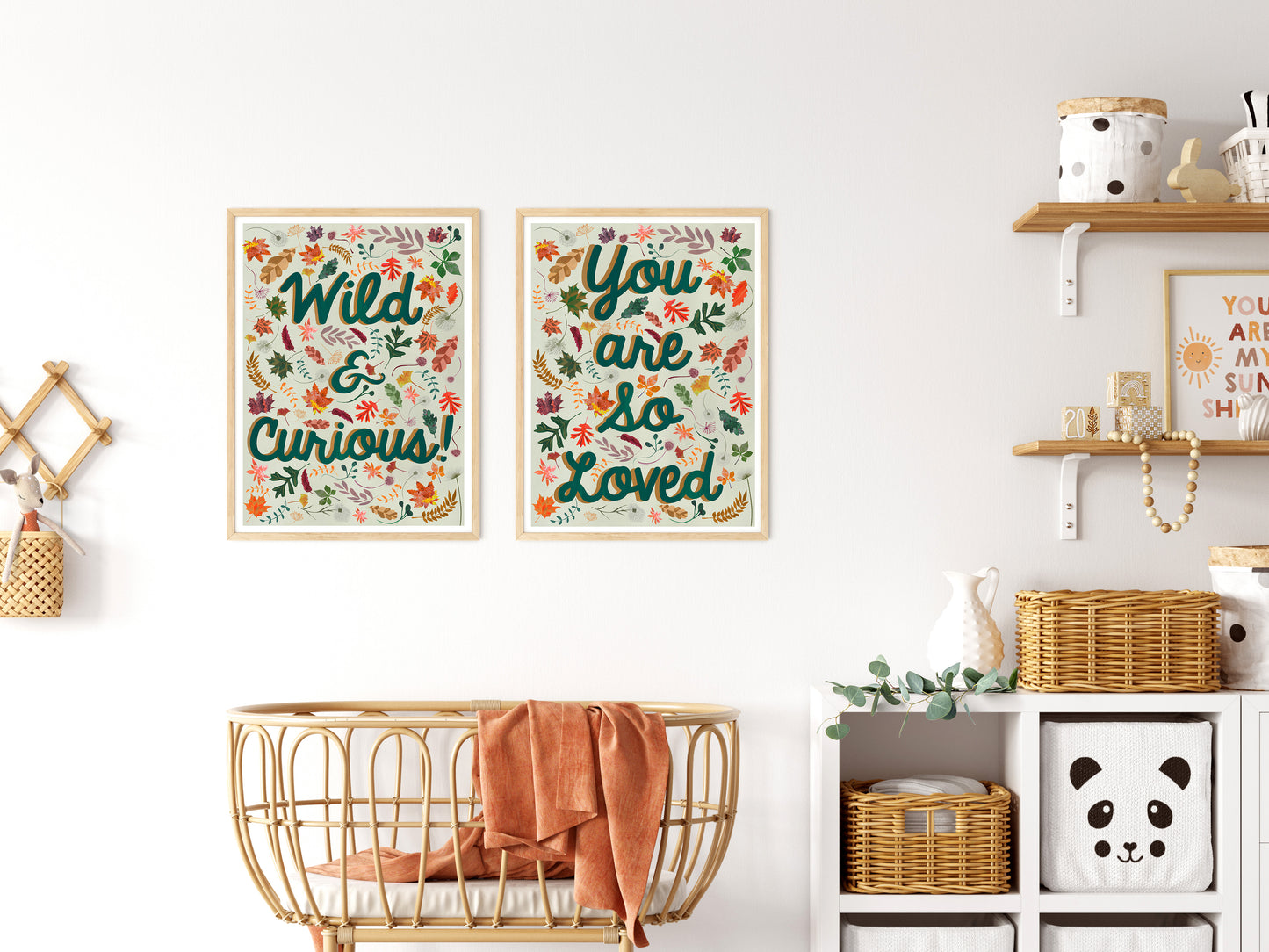 Nursery room with framed prints, a crib, and shelves.