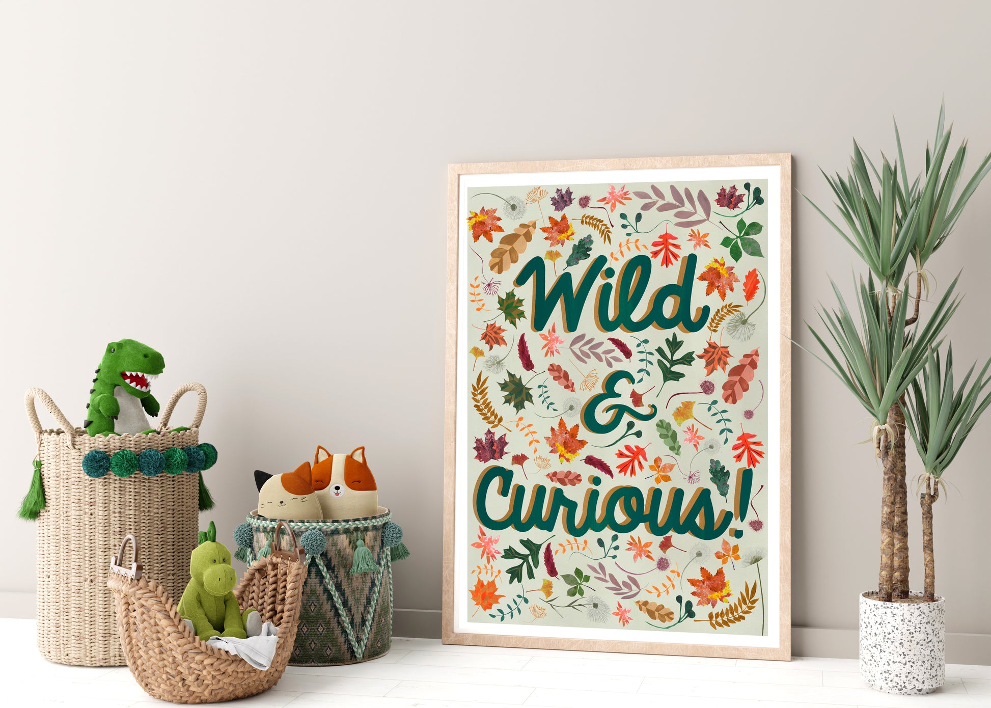 Decorative poster with 'Wild & Curious!' text in a frame, surrounded by children's toys and plants on a light background.