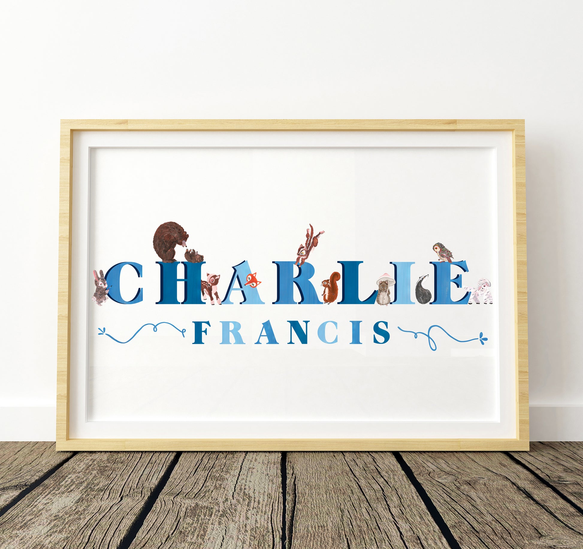 Framed artwork with 'CHARLIE FRANCIS' and woodland animal characters on a white background