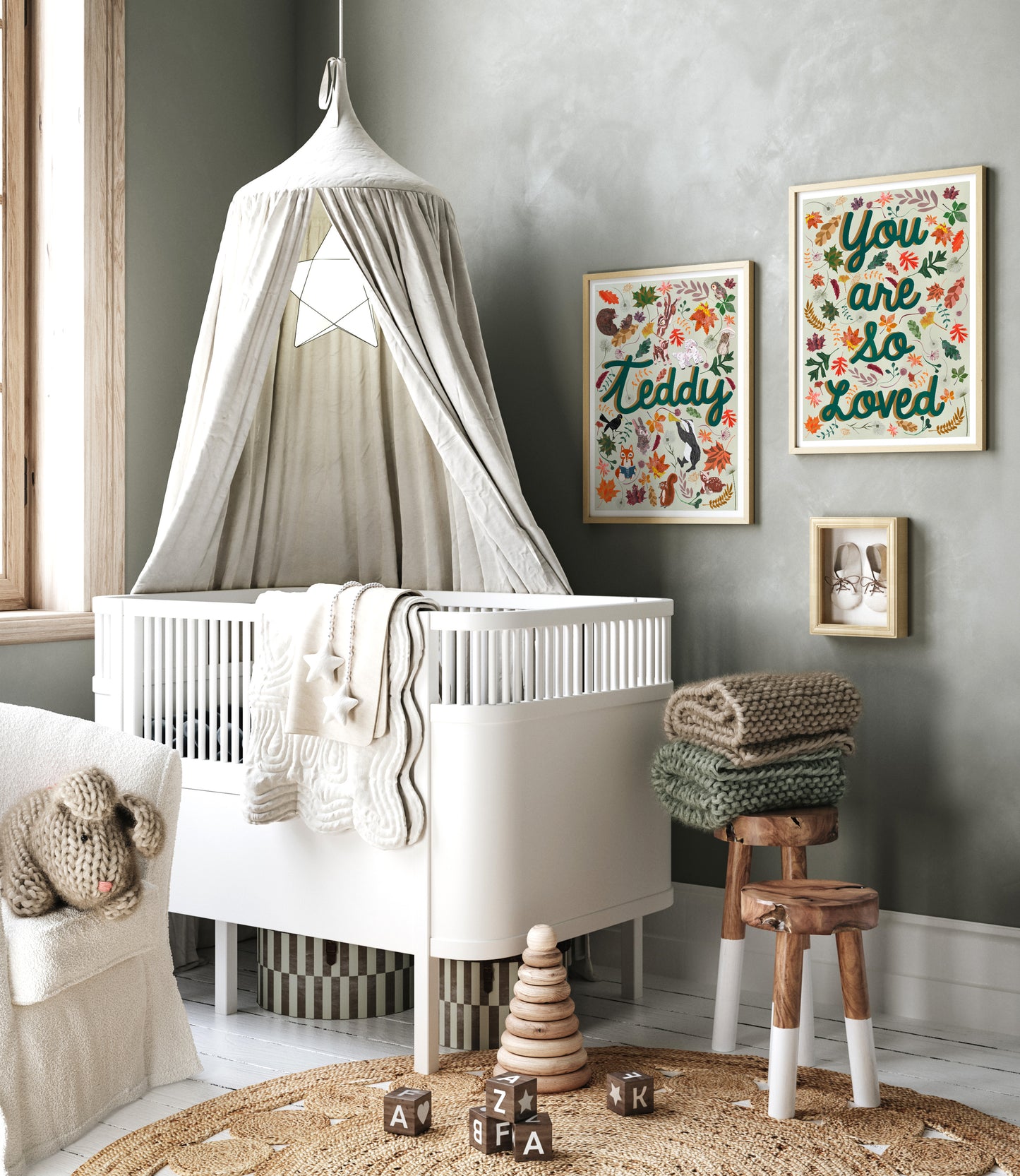 Nursery room with white crib, decorative elements, and wall art.